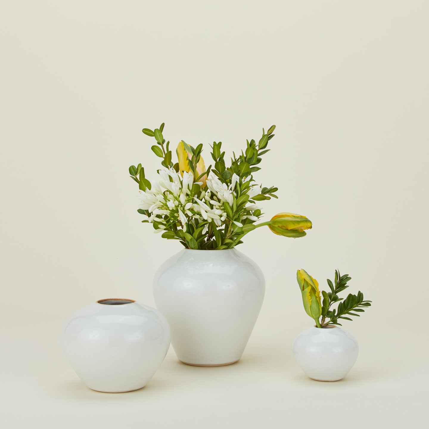 Verdure Vase in White in three sizes with flowers.
