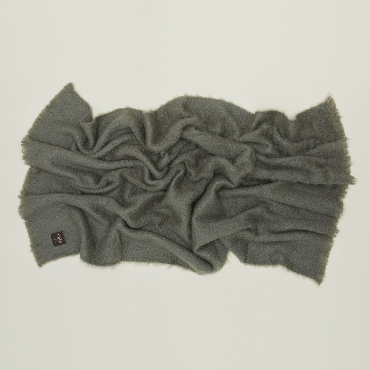 Solid Mohair Pillow in olive.
