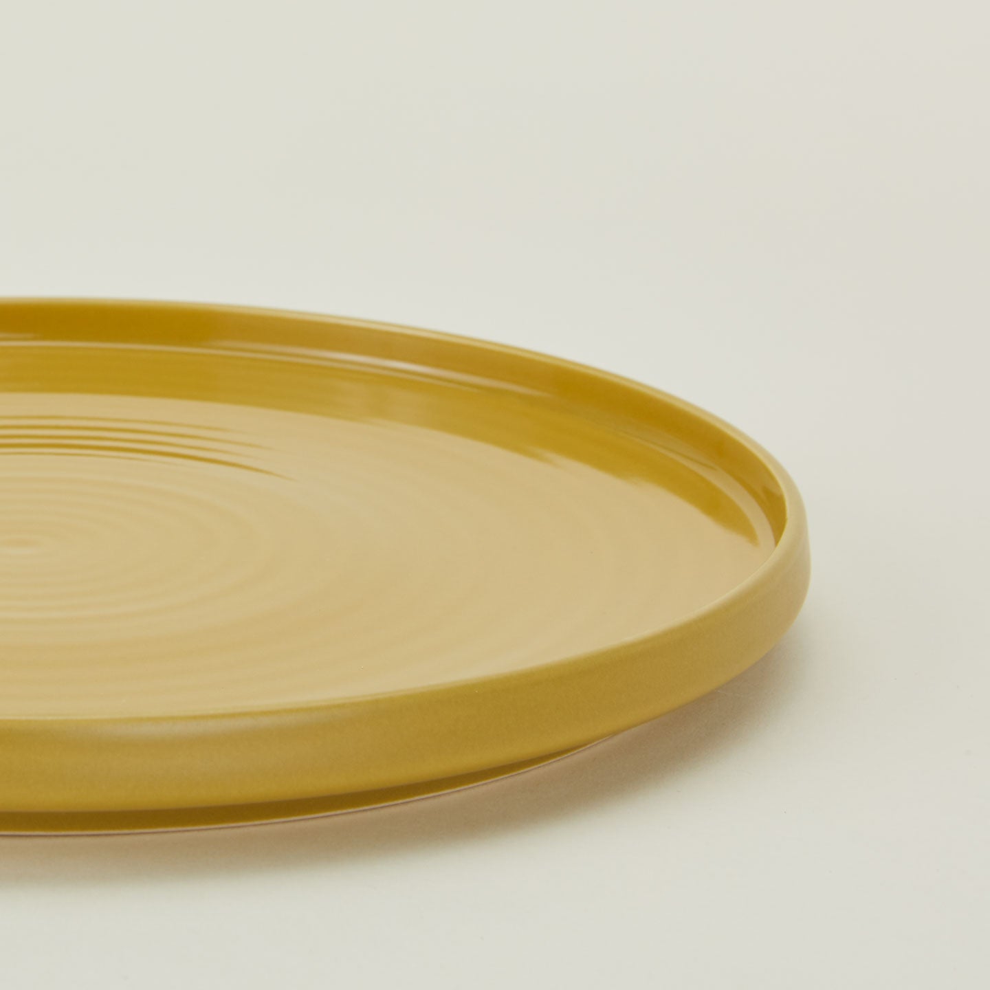 Close up of Essential Dinner Plate in Mustard.