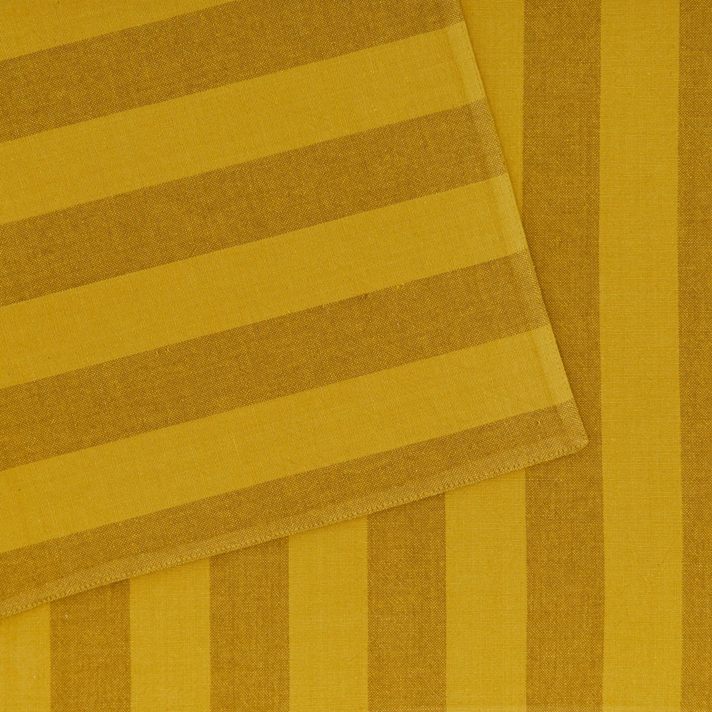 Close up of Essential Striped Placemat in Mustard and Bronze.