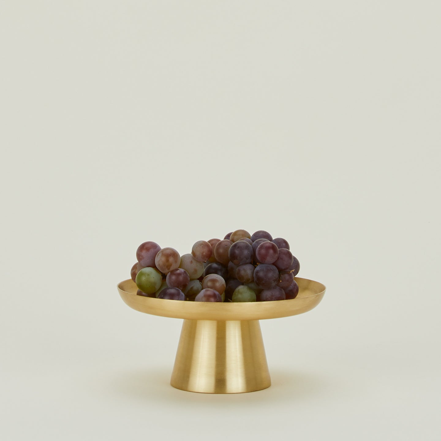 Brass Cake Stand in Small, with bunch of grapes.