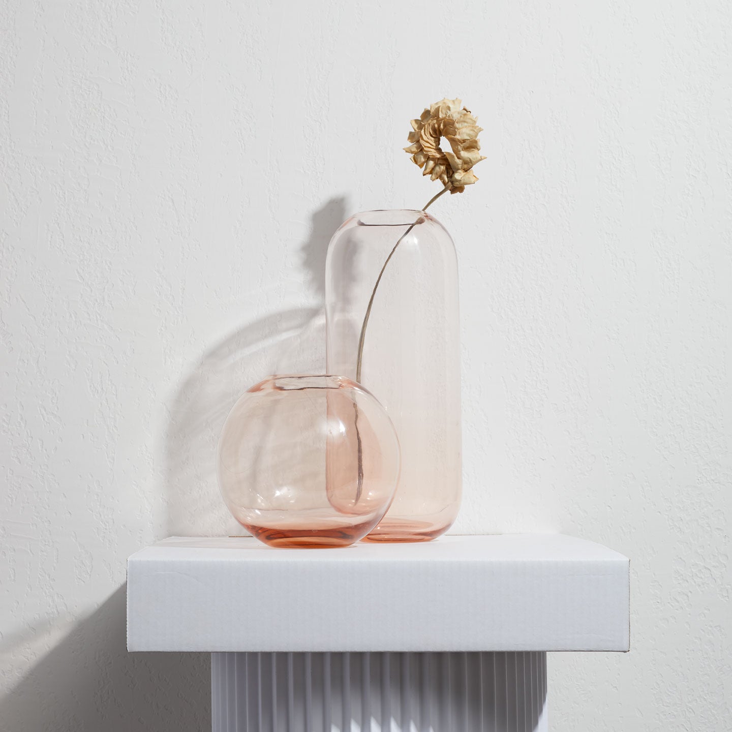 Aurora vases in blush with florals on a pedestal