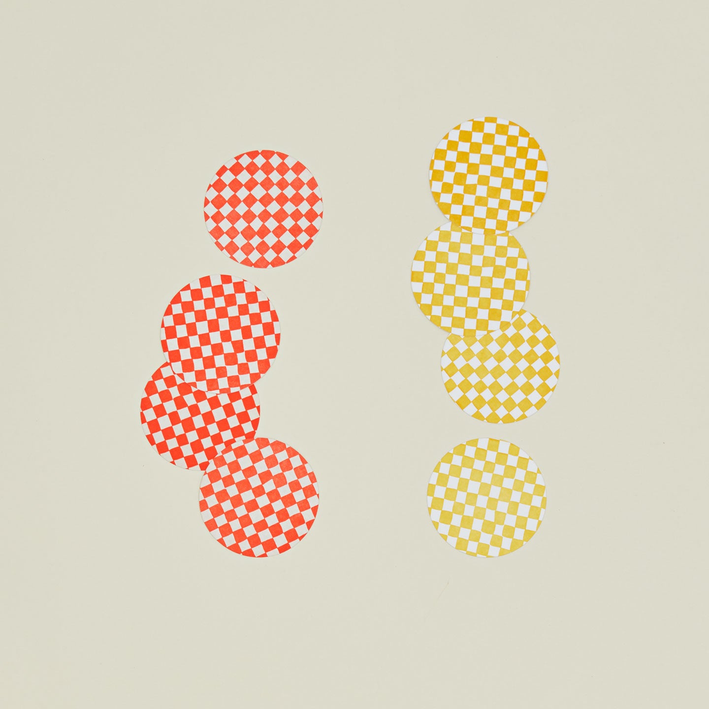 Set of eight reusable checkered paper coasters in two colorways.