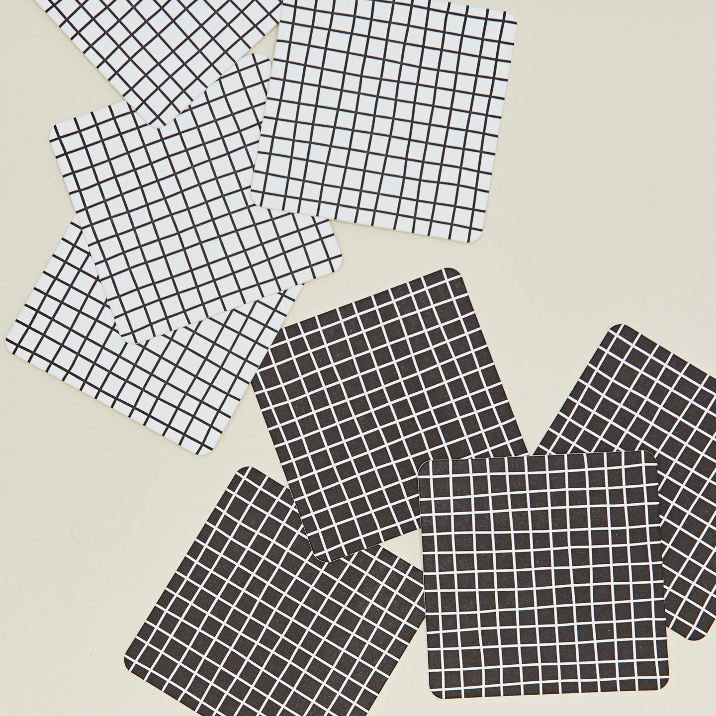 Close up of reusable gridded paper coasters.