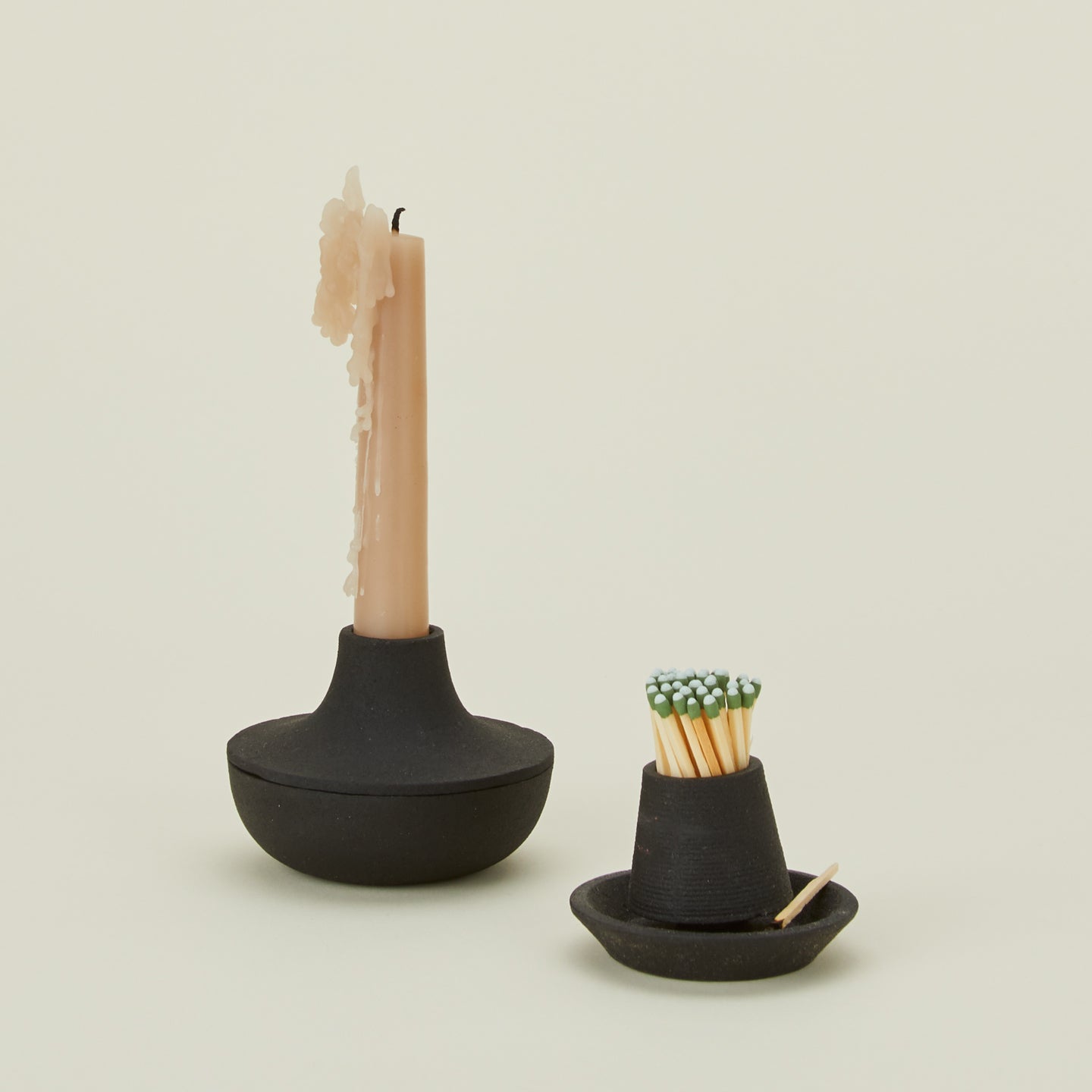 Areaware cast iron matchstriker with candle holder and matches