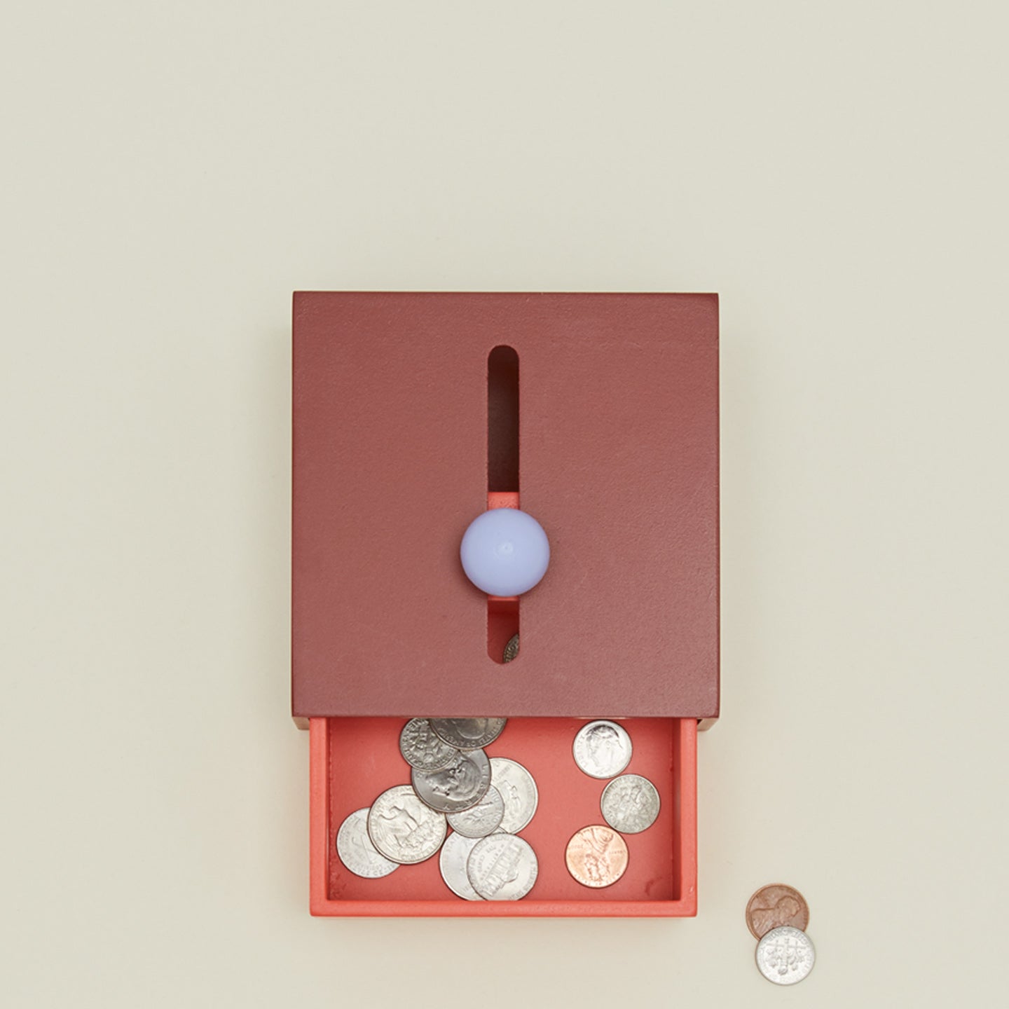 Overhead view of cache box with coins