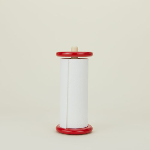 A red and yellow paper towel holder with paper towel.