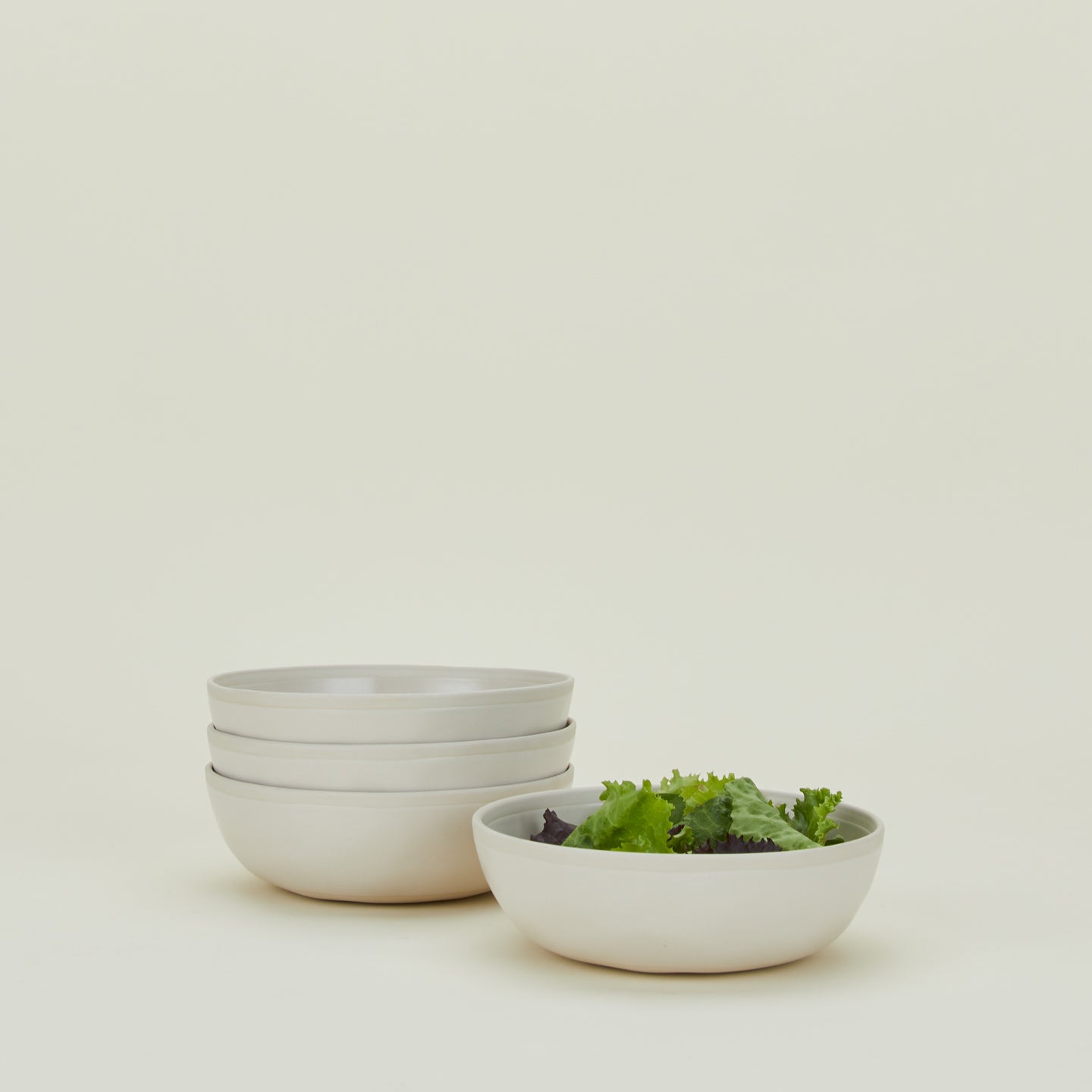 Four Atelier Medium Bowls, with lettuce.