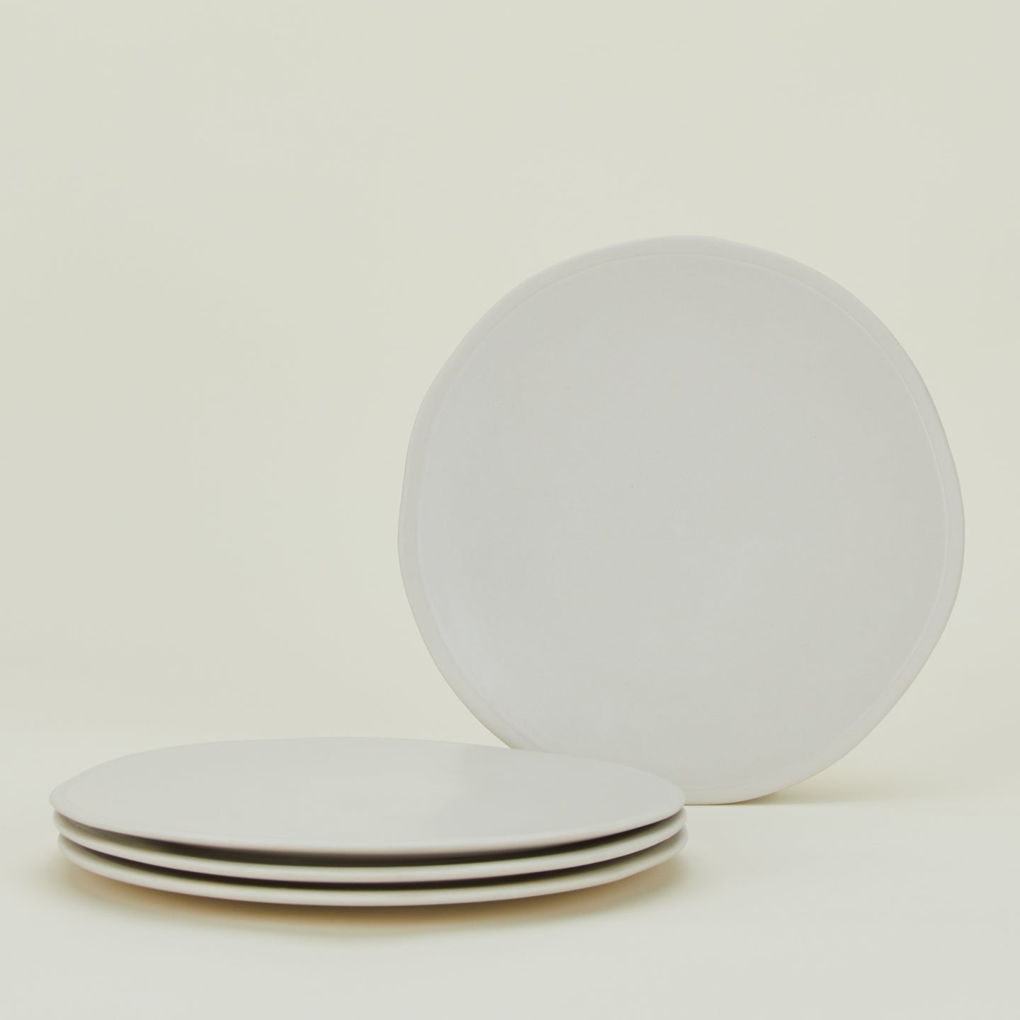 Four Atelier Dinner Plates.