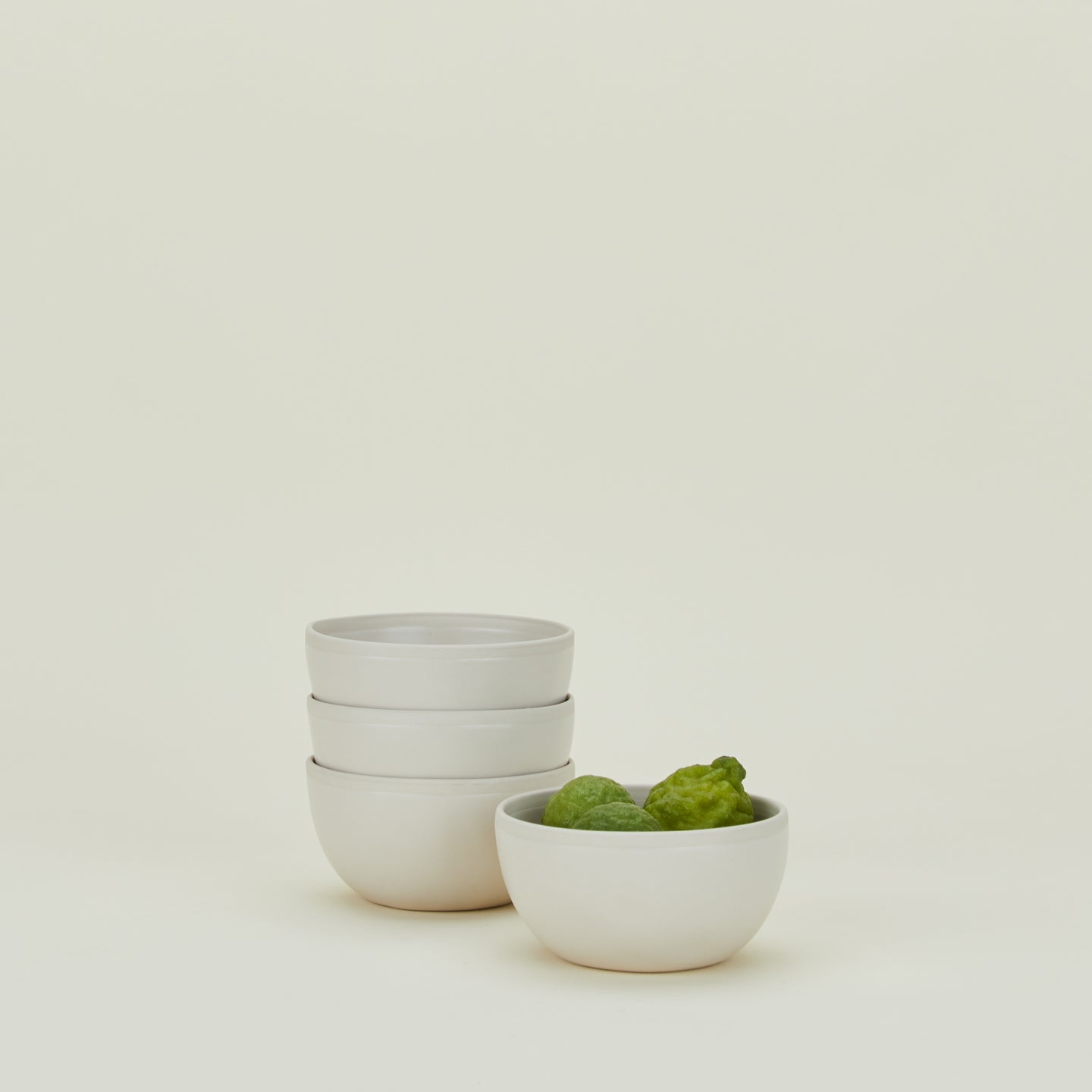 Four Atelier Small Bowls, with limes.