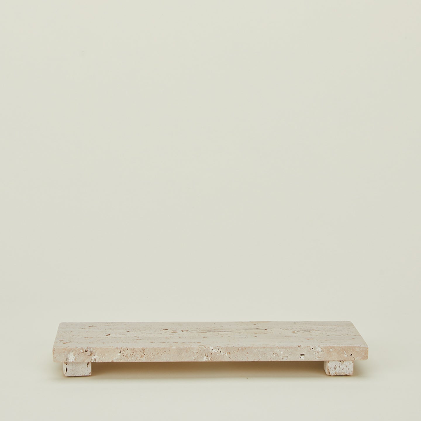 Travertine footed serving board