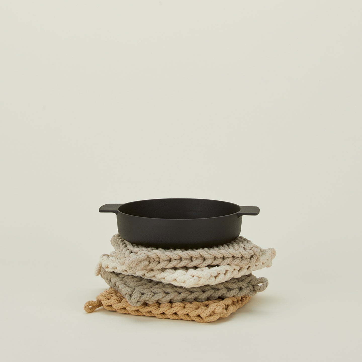 Crocheted pot holders in natural colors with skillet