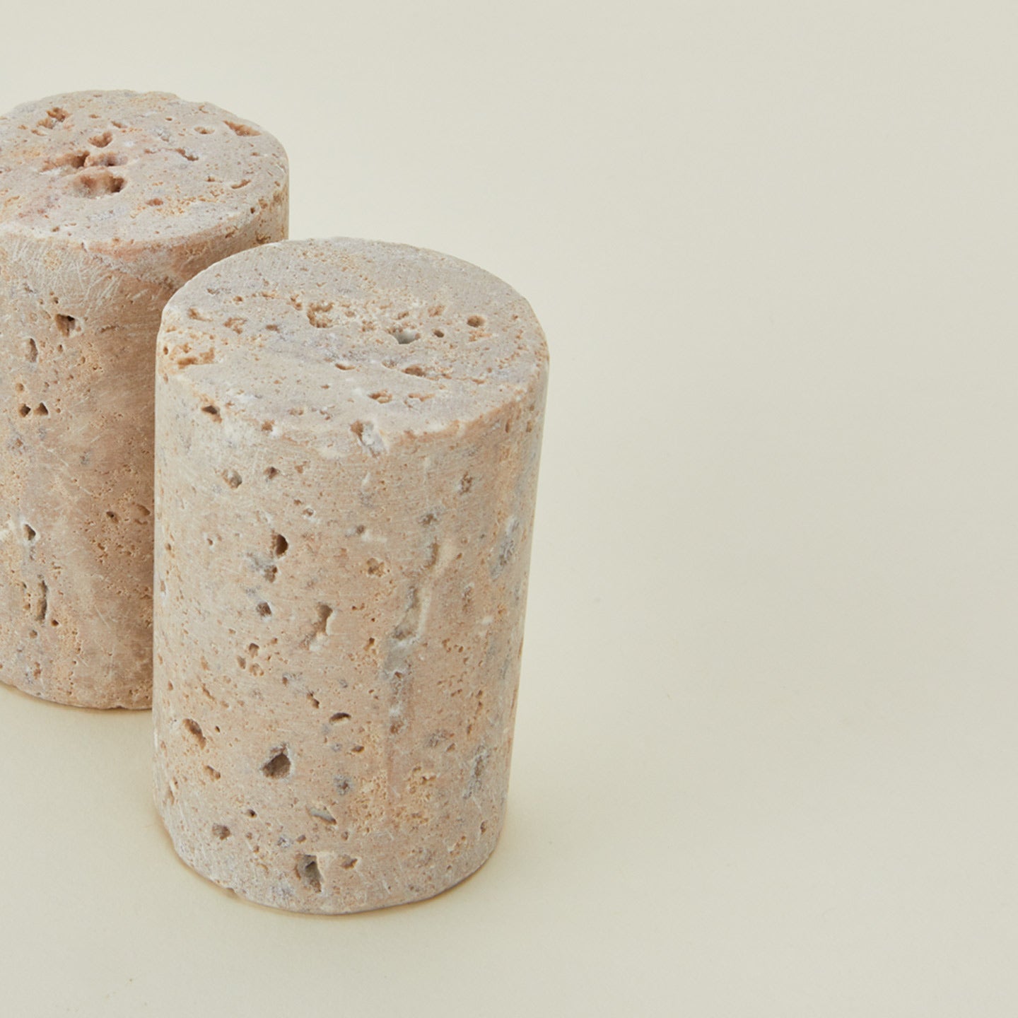 Close up view of travertine salt and pepper shakers