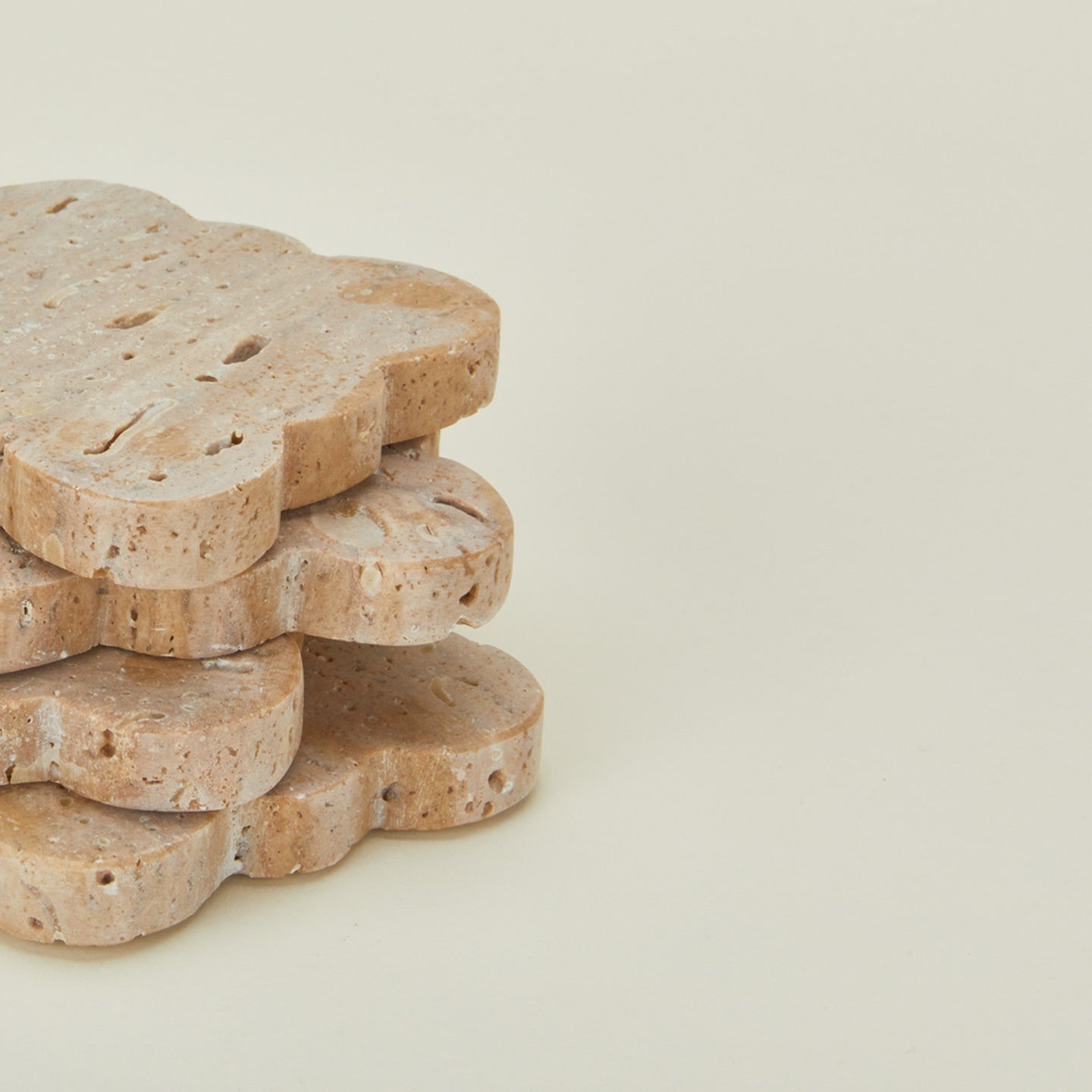 Close up view of travertine scalloped coasters