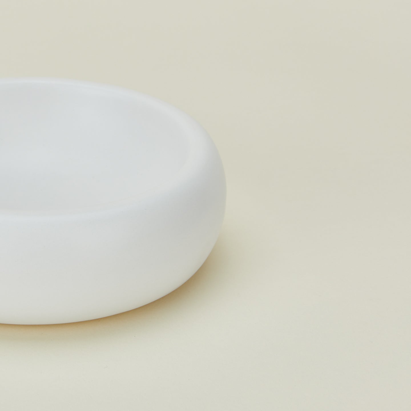 Close up view of concave ceramic bowl in white