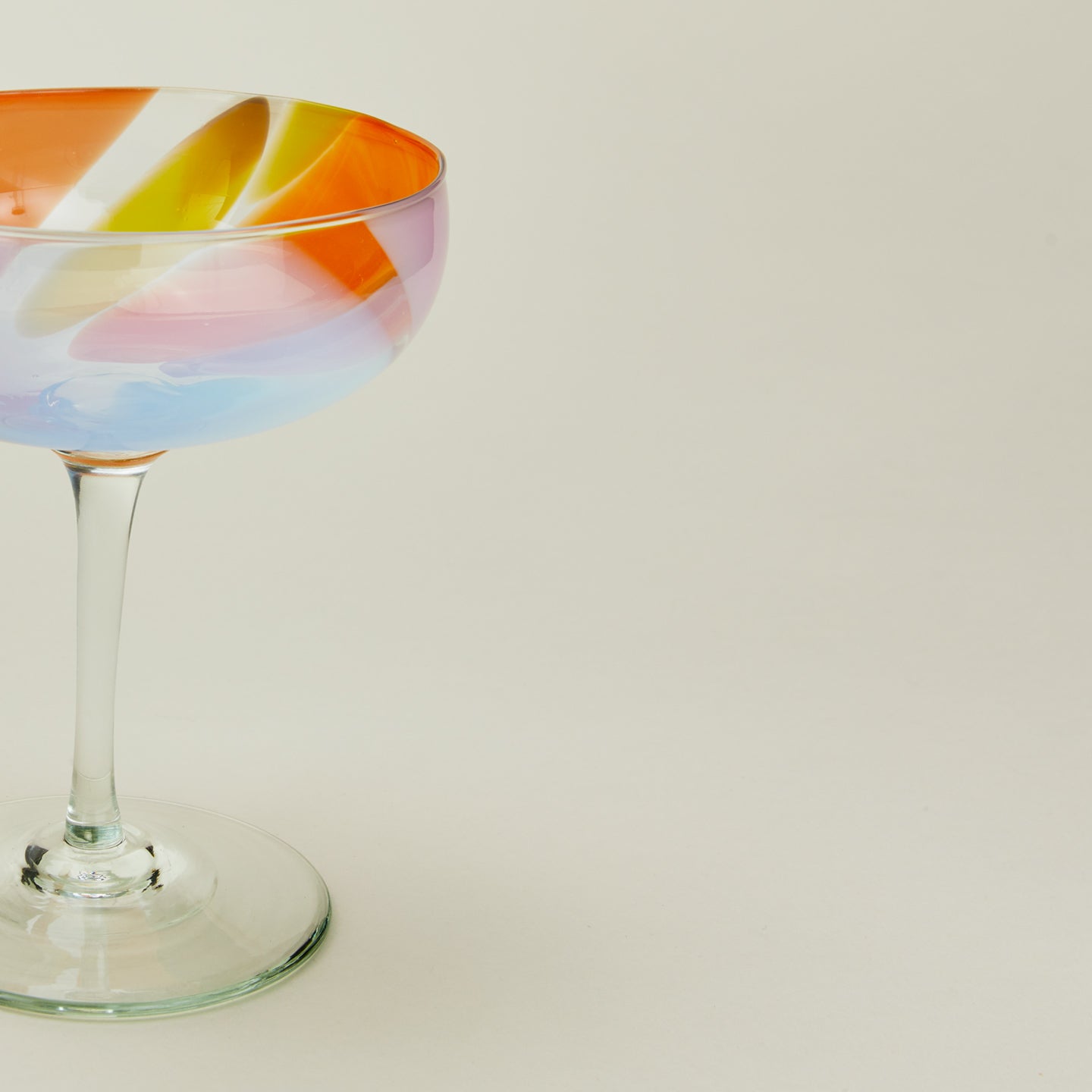 Close up view of bow glassware coupe in multicolor