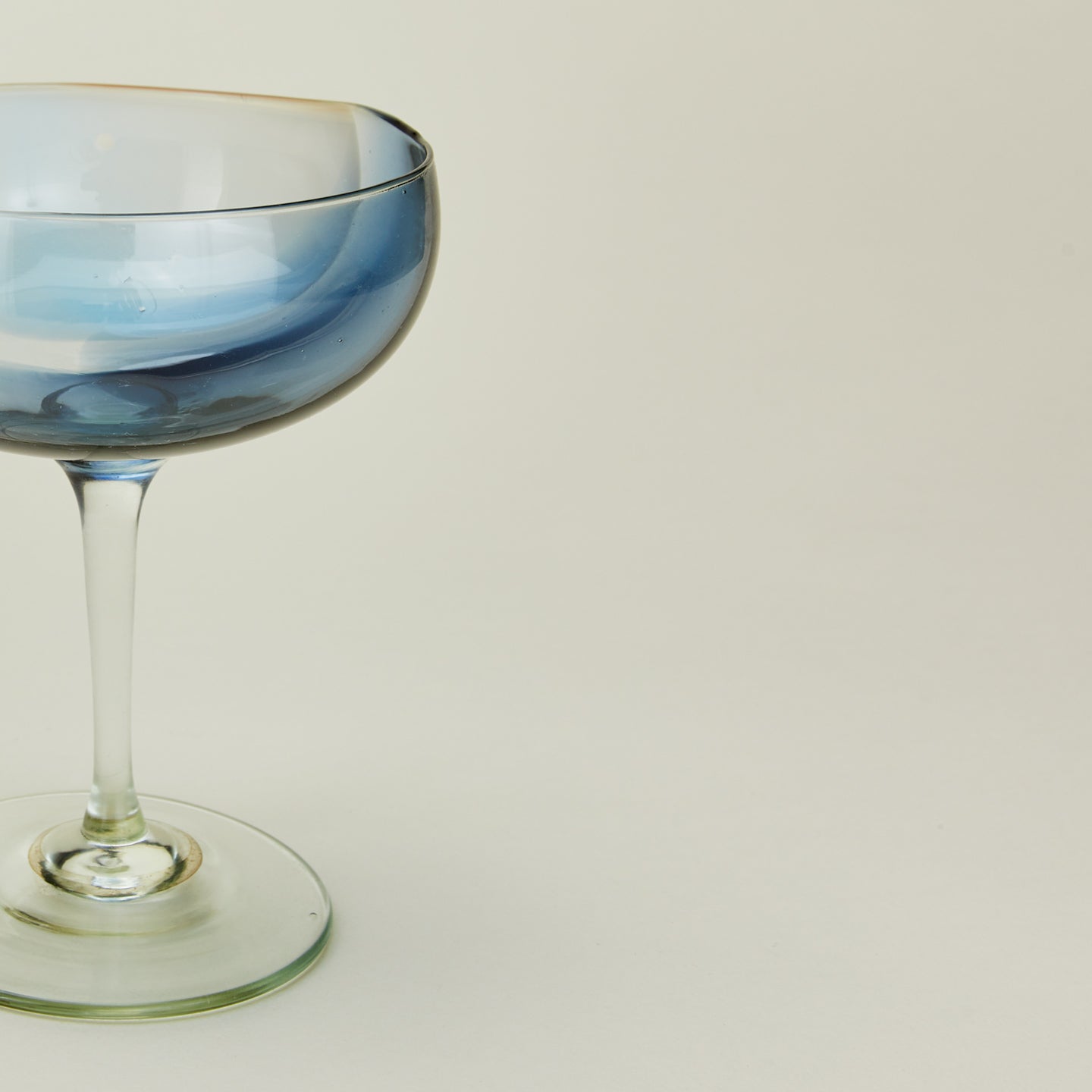 Close up view of Bow Glassworks coupe in sky and peacock