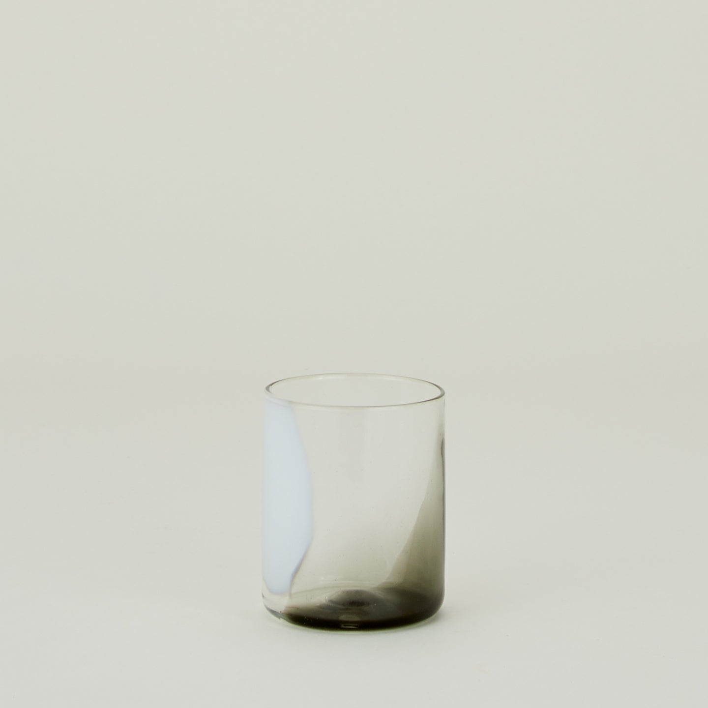 Blown Glass Tumbler with white and grey swirl pattern.