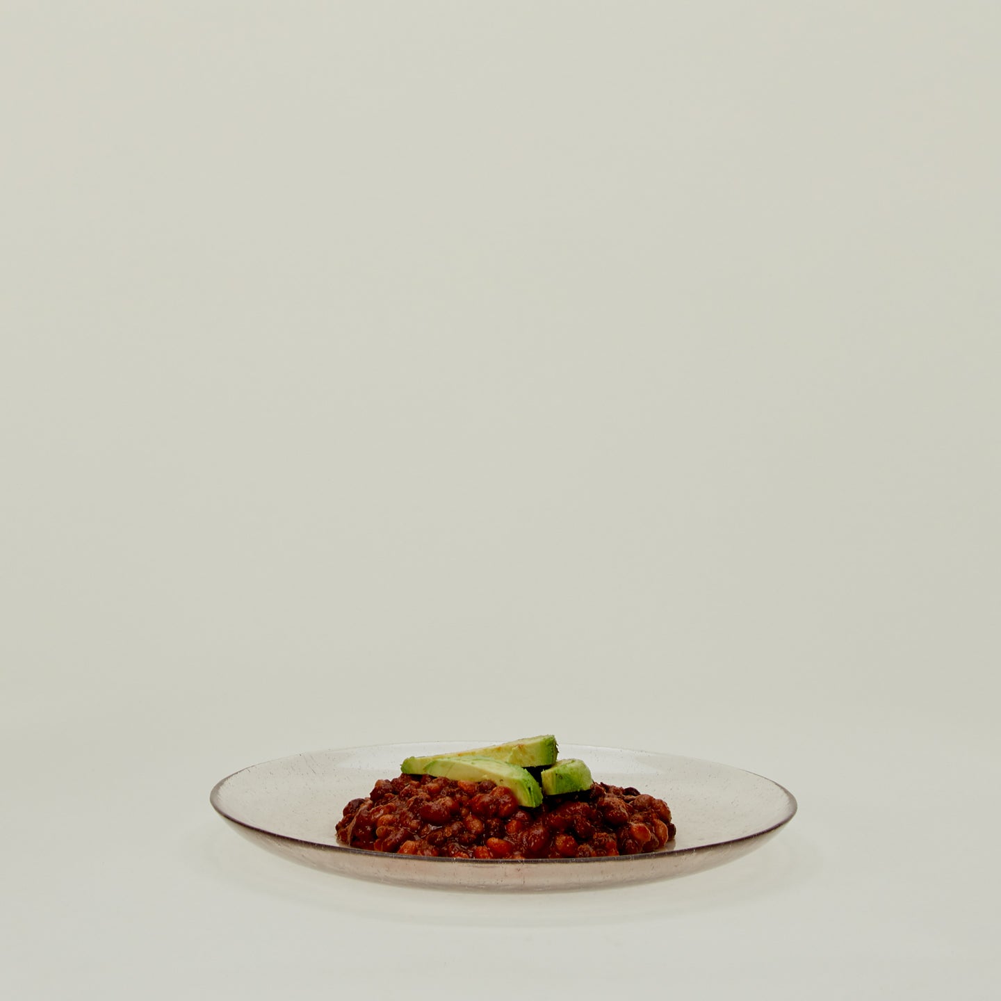 Glass Dinner Plate in Blush, with beans and avocado.