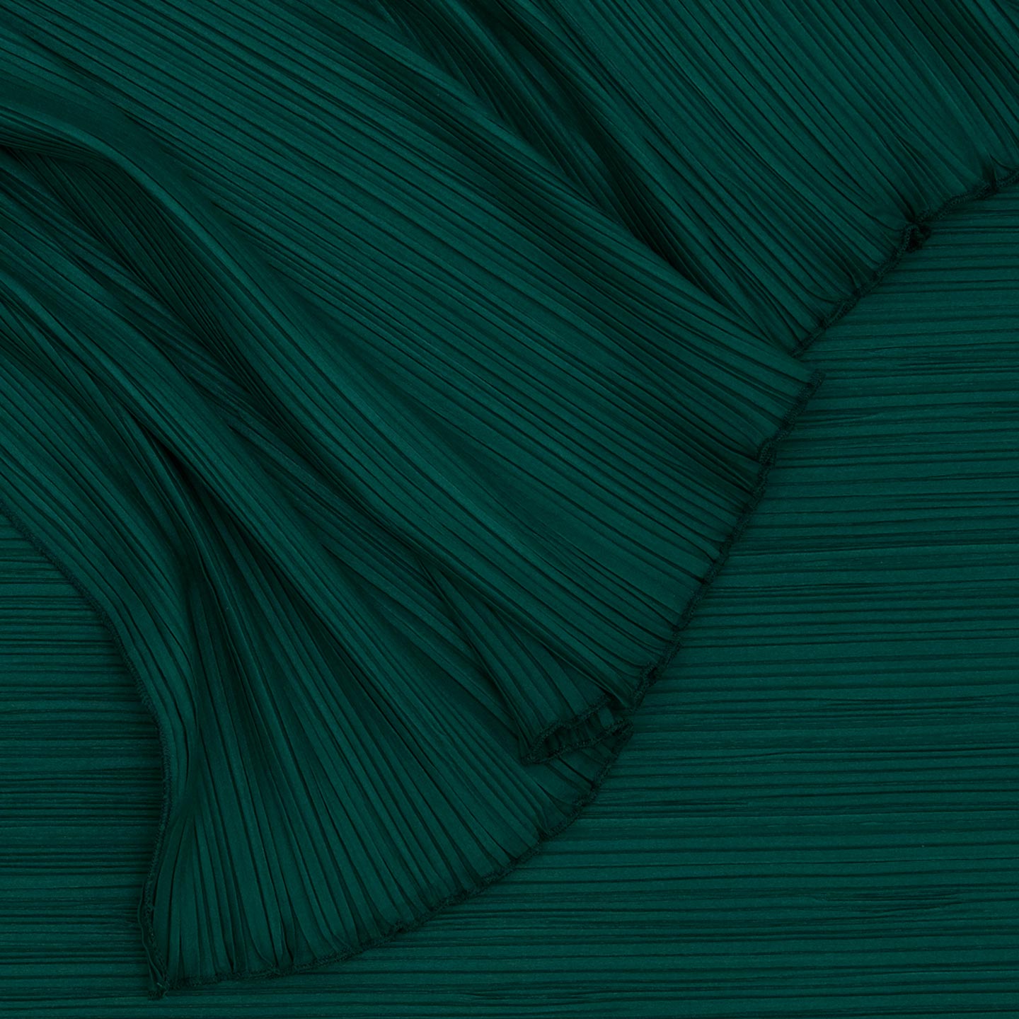 Detailed view of Cahaya pleated tablecloth in olive