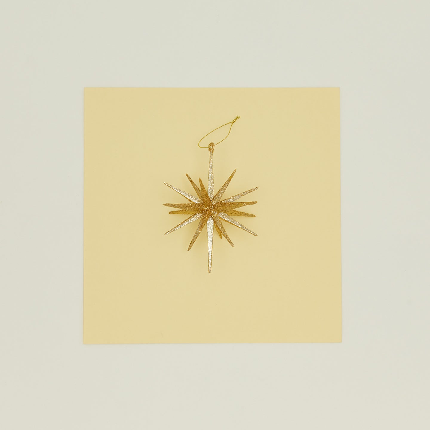 Gold glitter starburst ornament