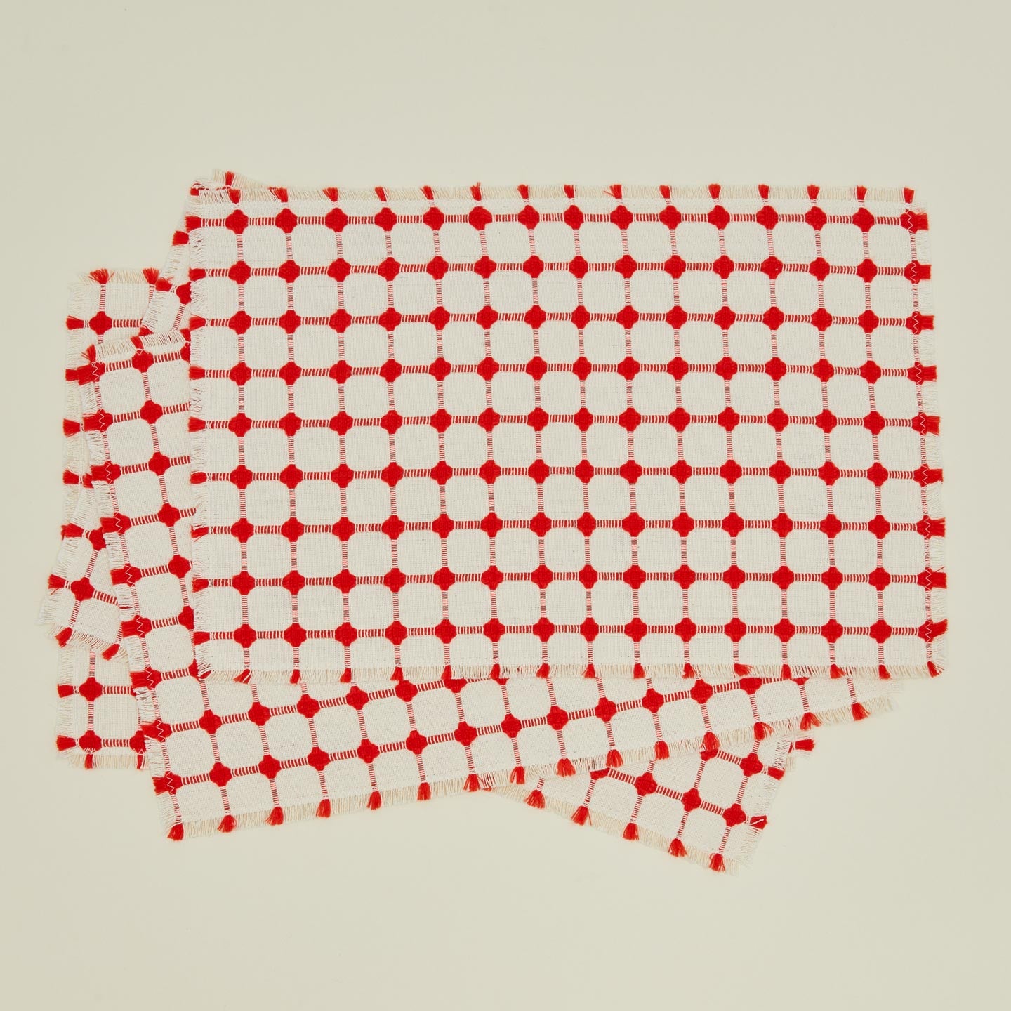Dove and Donkey wicker fringed placemat in cherry