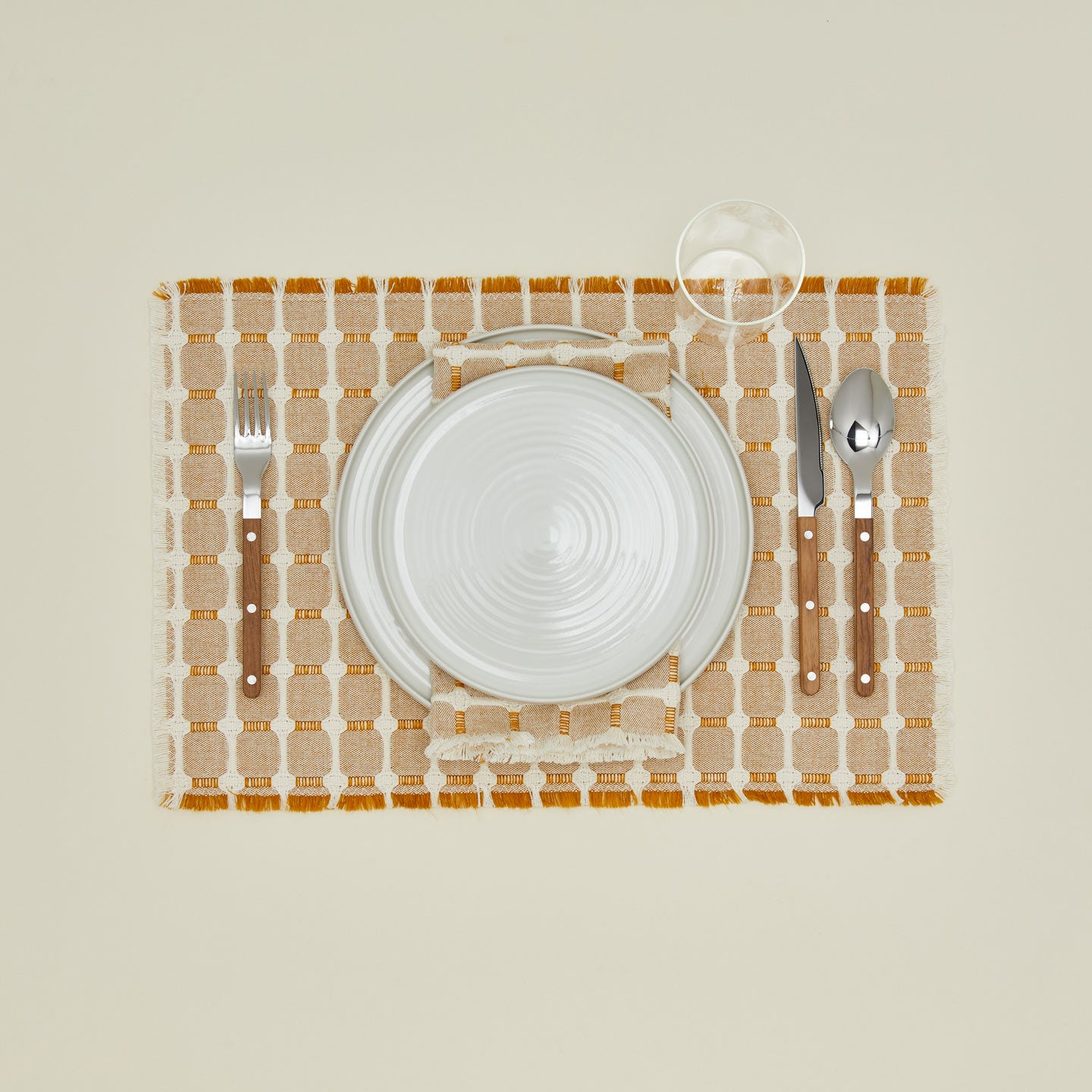 Dove and Donkey hopsack placemat in honey with place setting