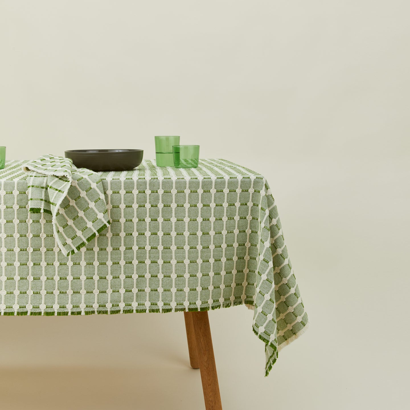 Dove and Donkey hopsack tablecloth in leaf with place setting