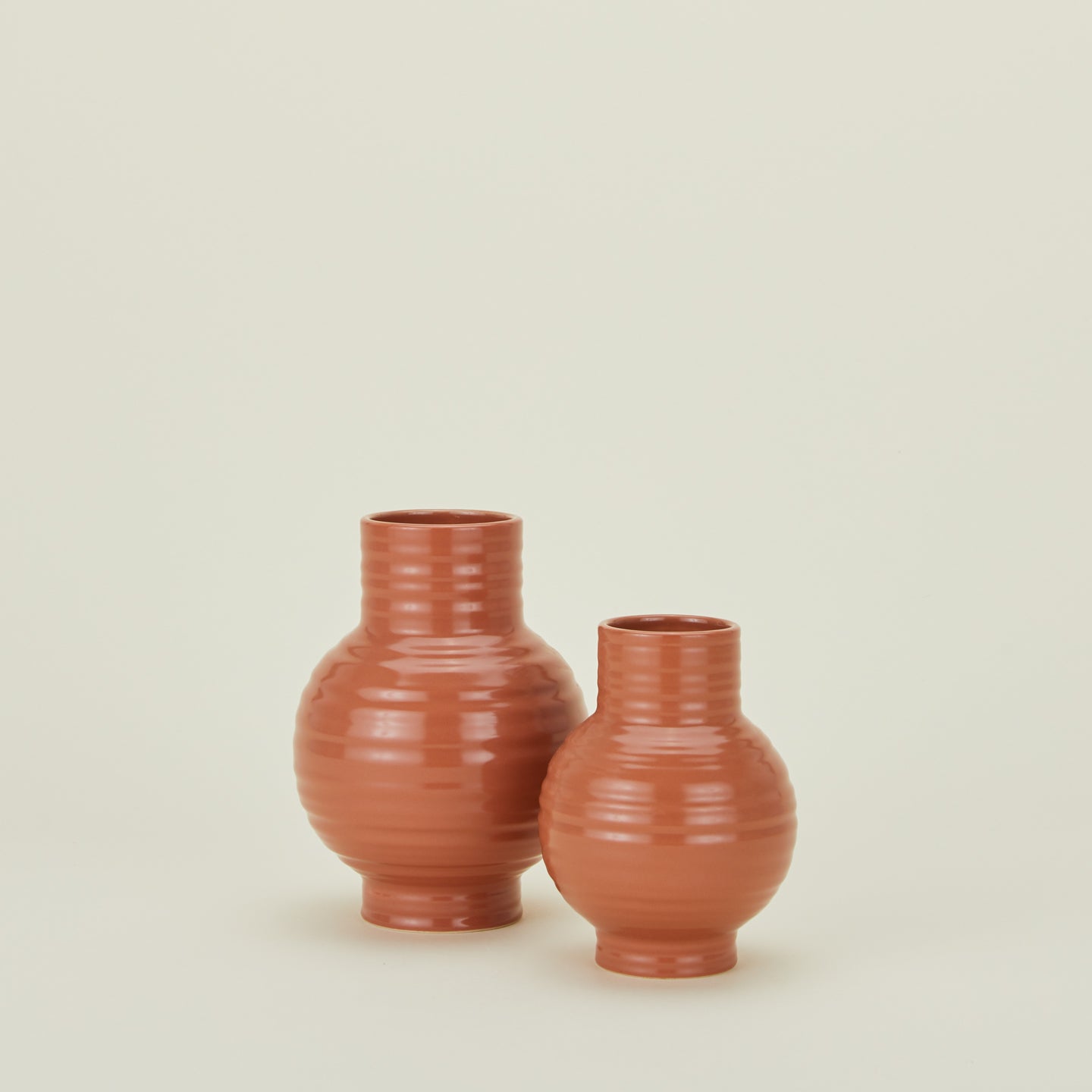 Large and small essential ceramic vases in terracotta