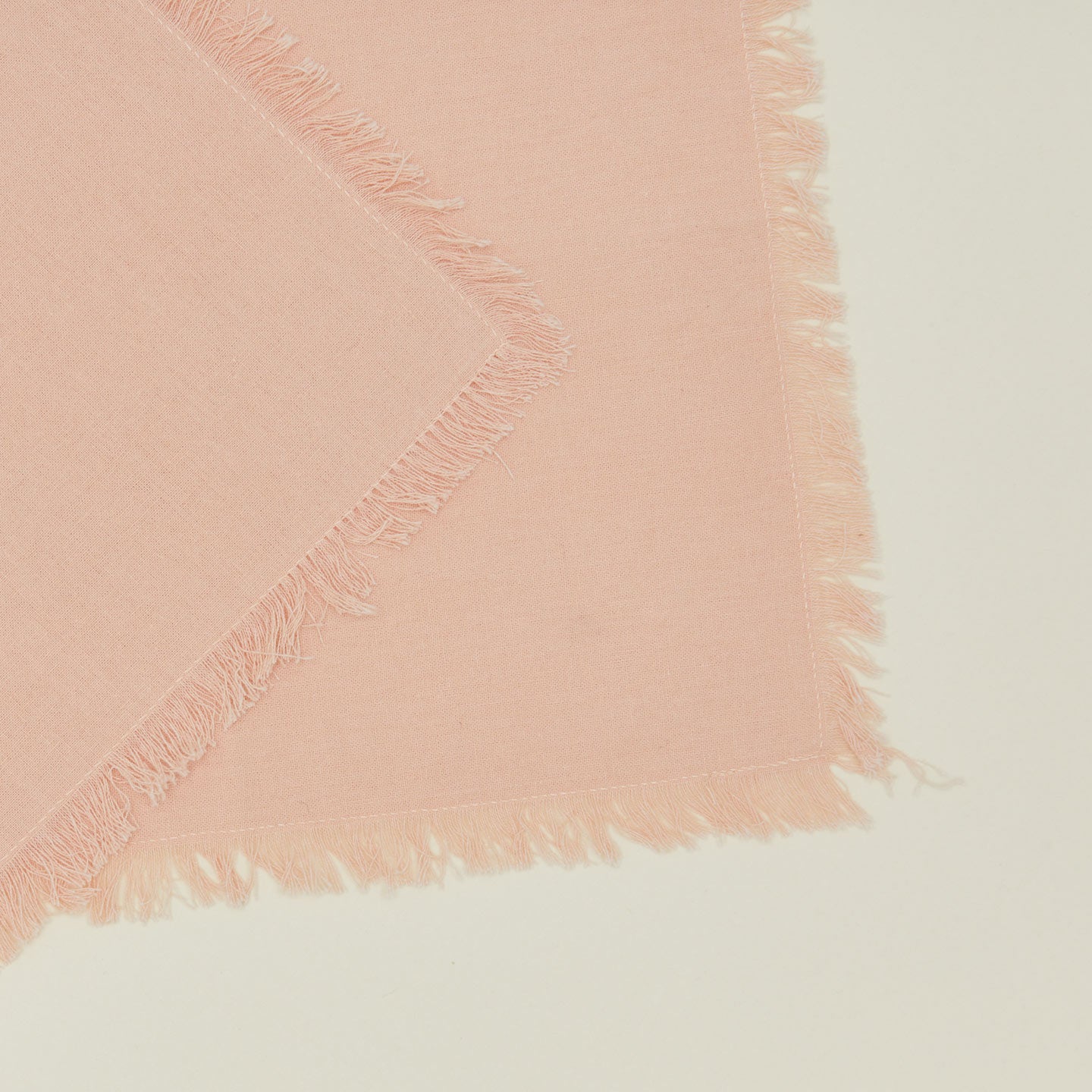 Close up view of essential cocktail napkin in blush