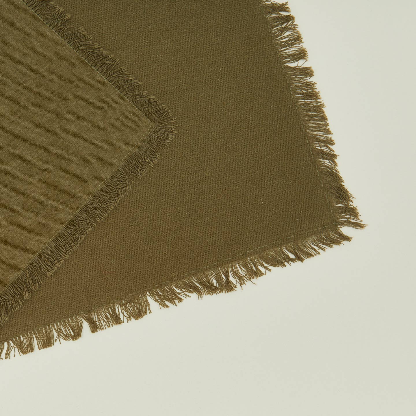 Close up view of essential cocktail napkin in olive