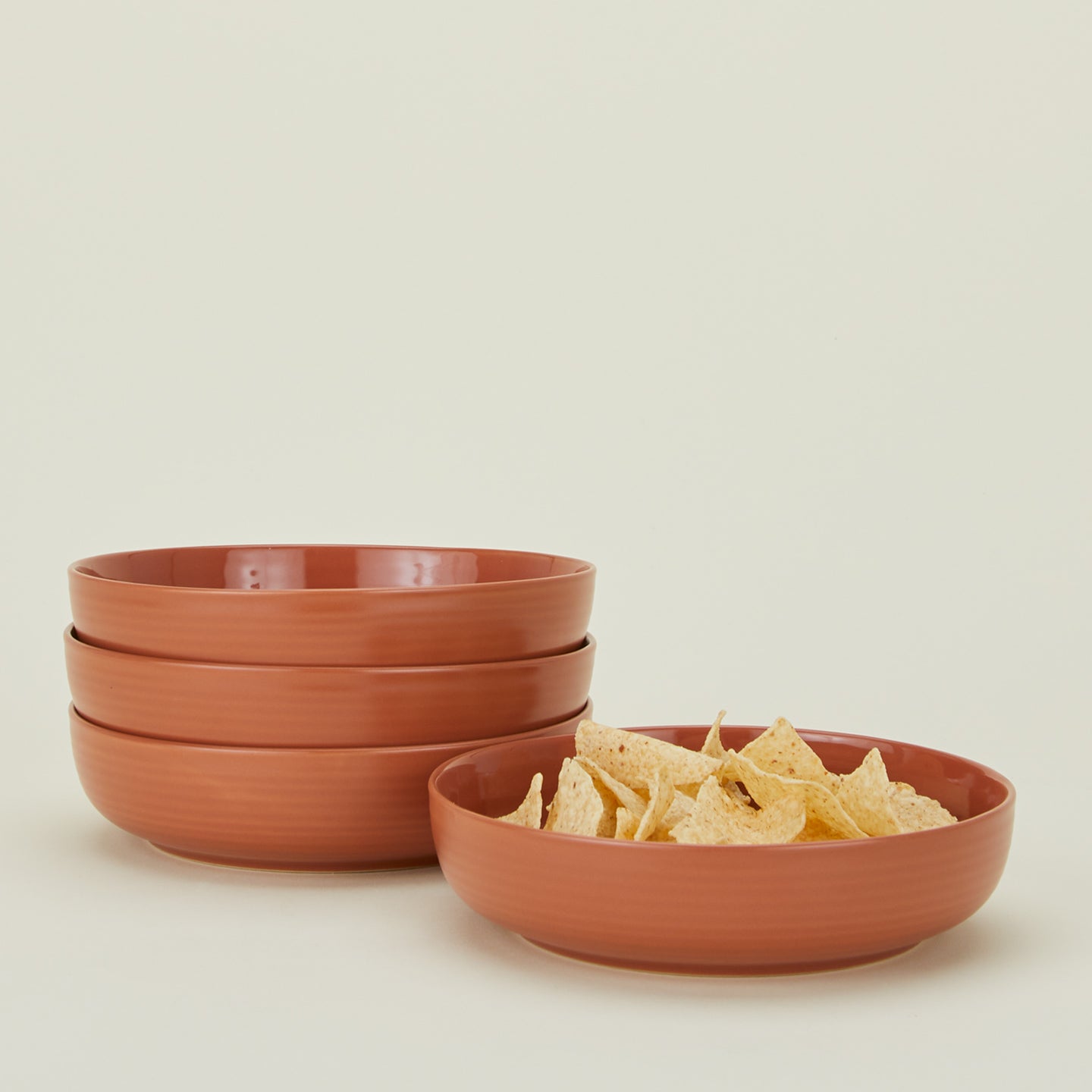 Essential dinnerware low bowl in terracotta with tortilla chips