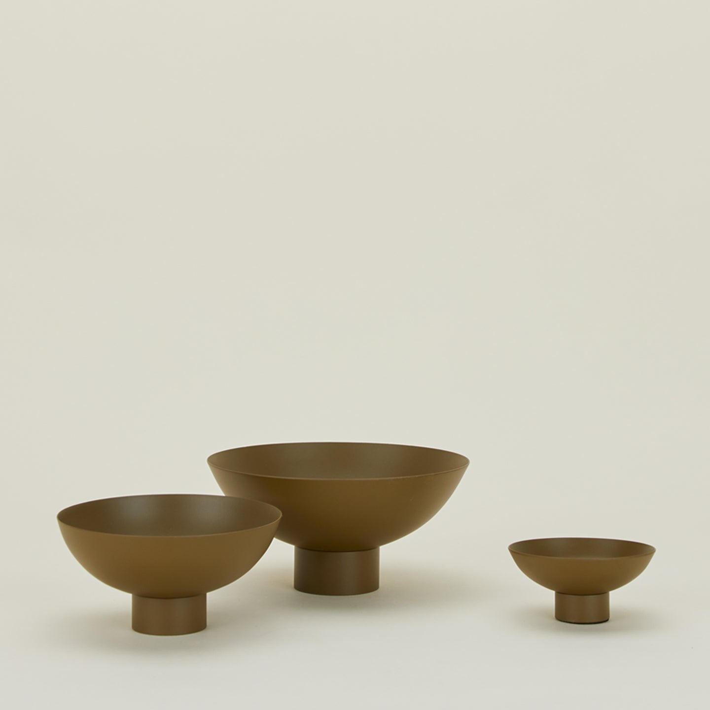 Essential footed bowl family in olive