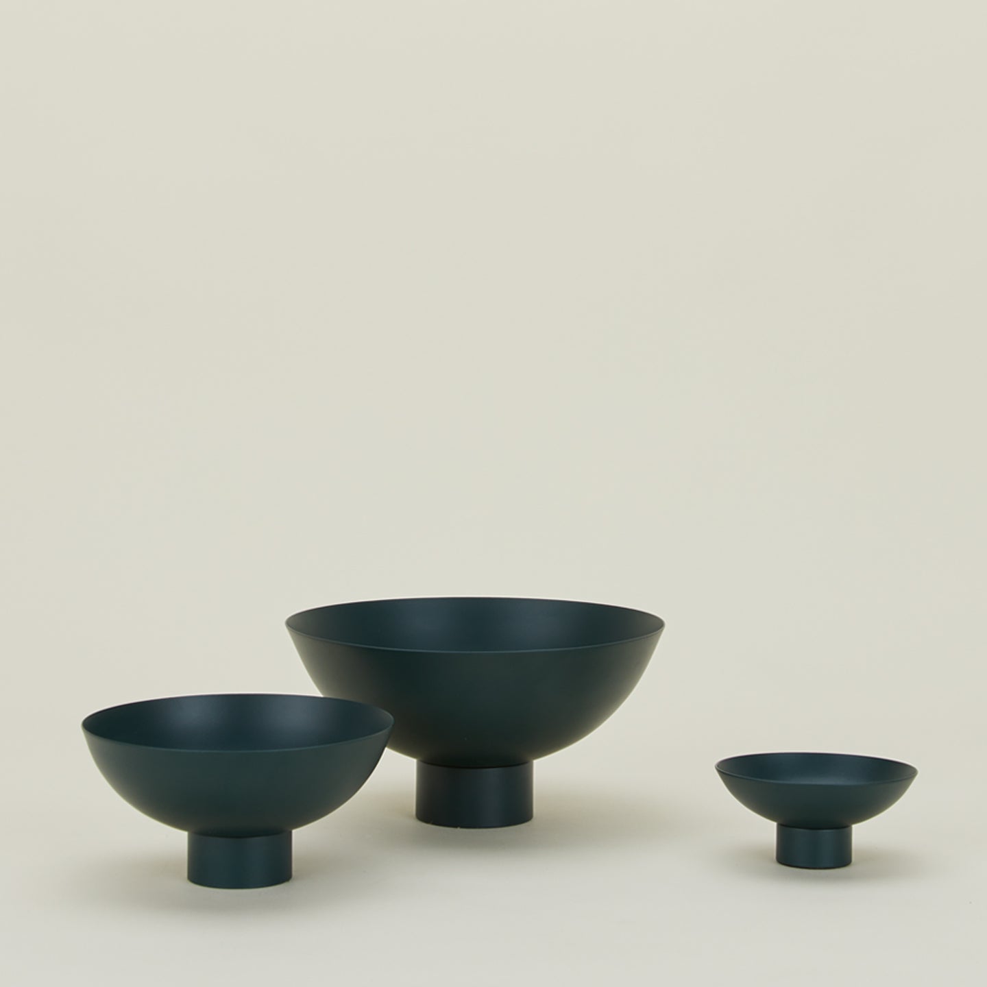 Essential footed bowl family in peacock