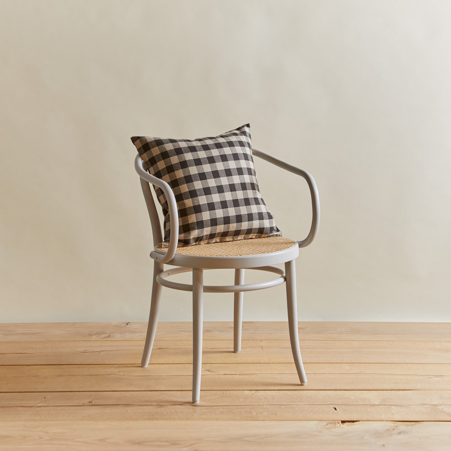 Essential gingham pillow in grey/black on chair