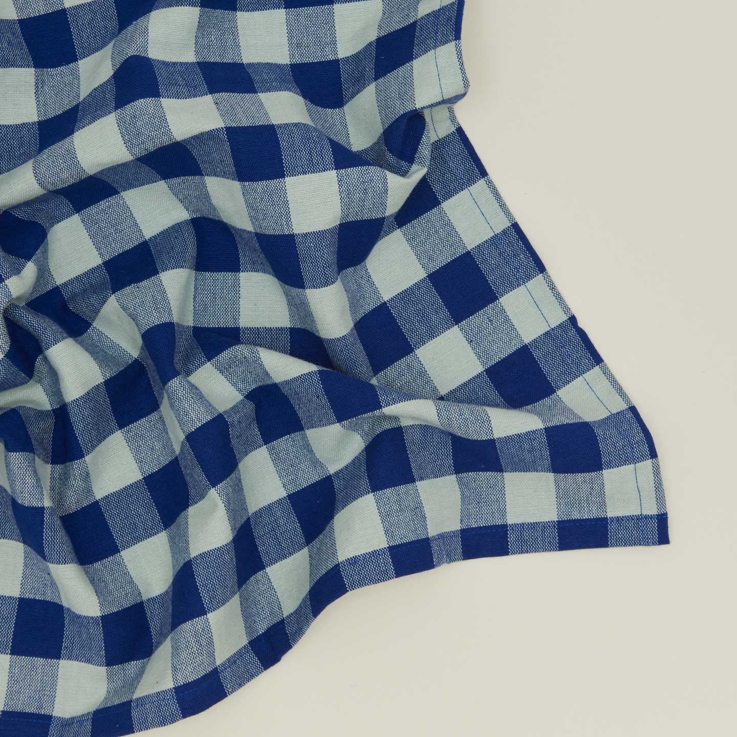 Close up view of Essential Gingham napkin in sky/blue
