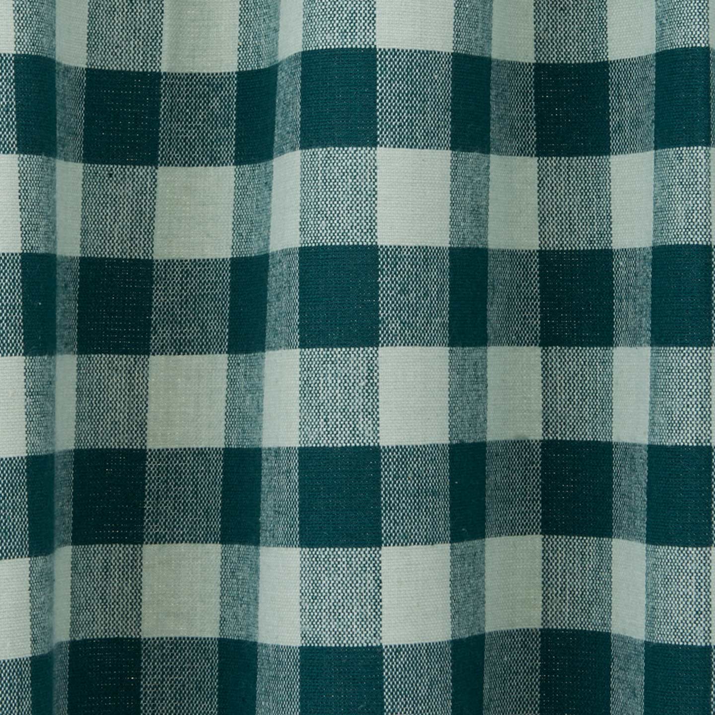 Close up view of gingham shower curtain in sky/peacock