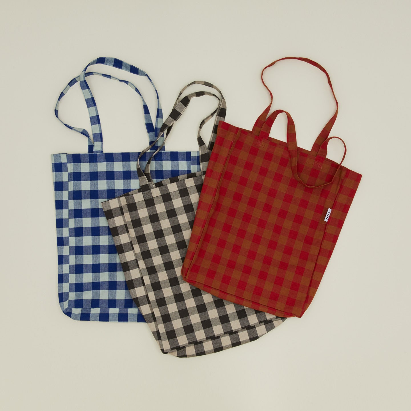 Gingham tote bags in various colors