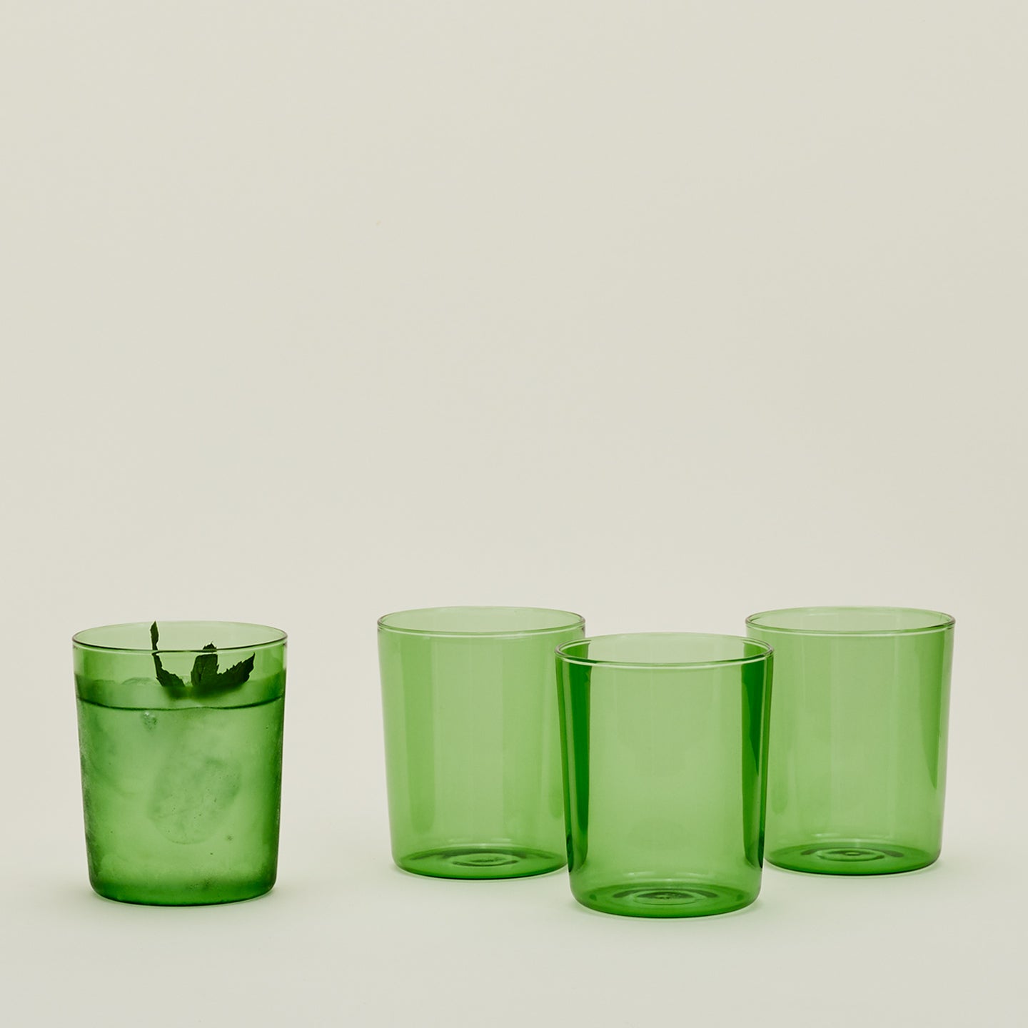Four Medium Essential Glasses in Green.
