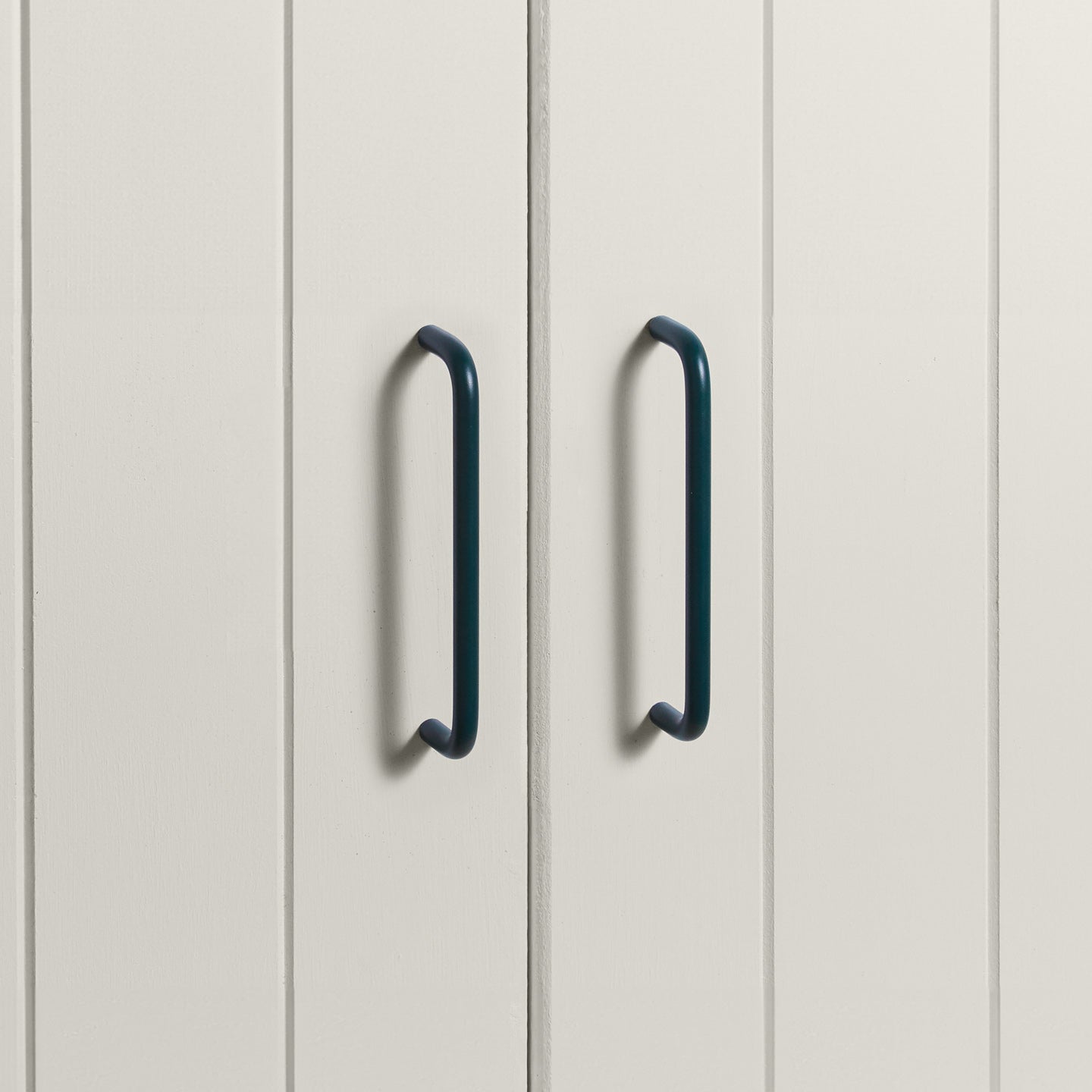 Large peacock pulls on white doors