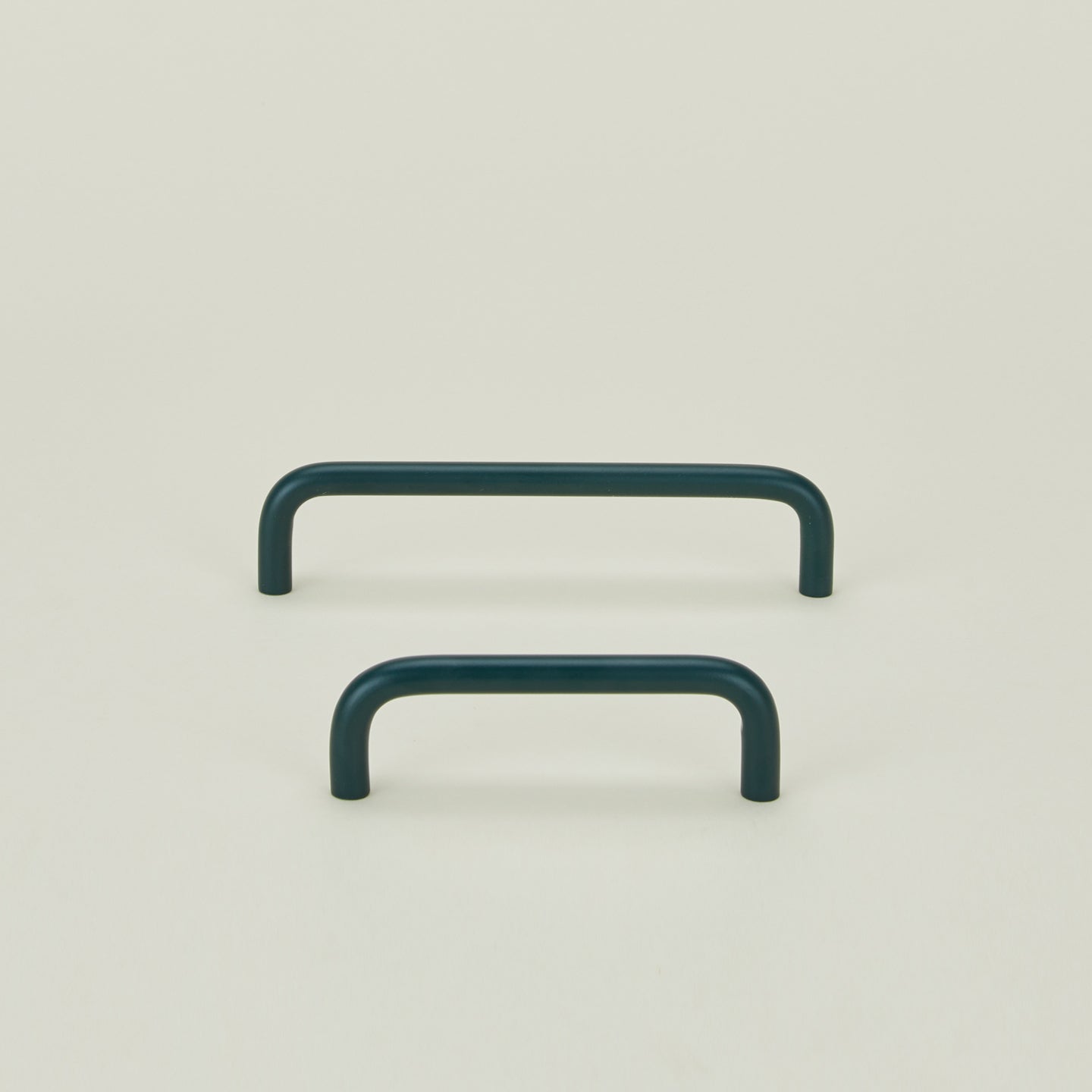 Small and large drawer pulls in Dark Peacock.