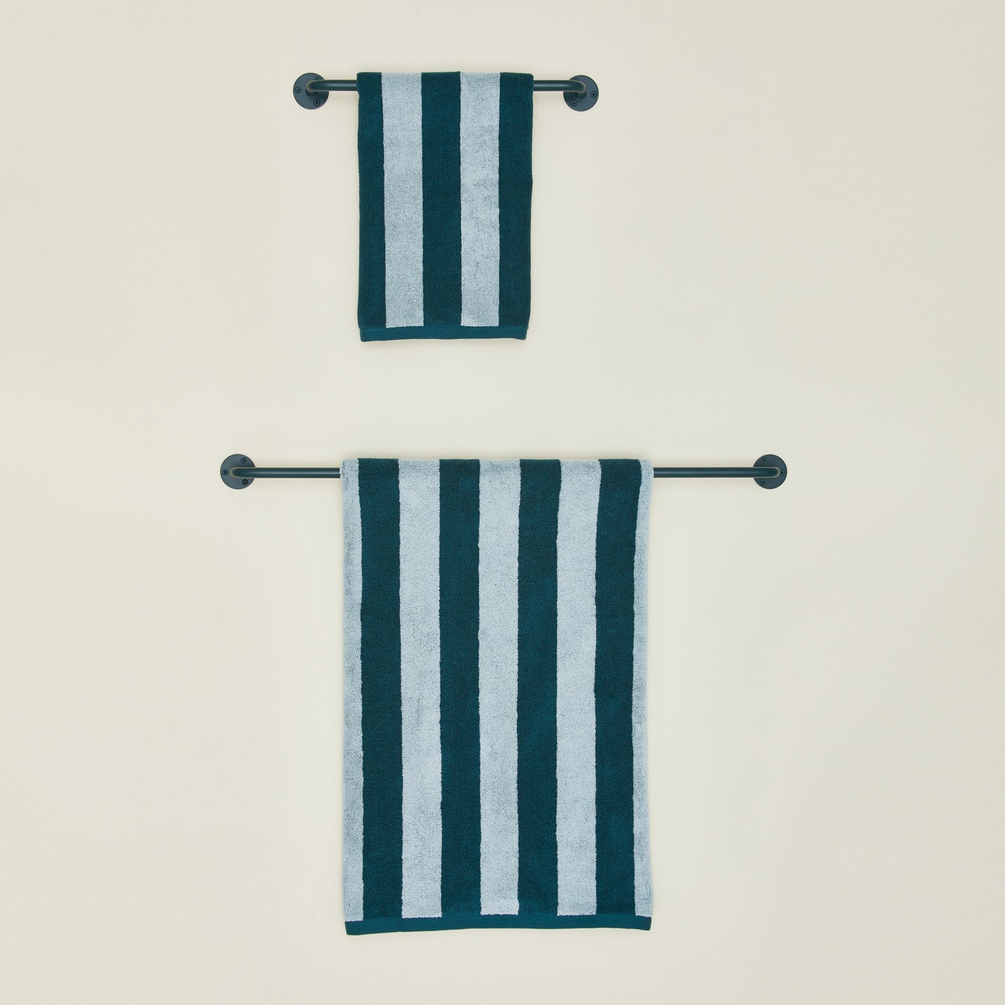 Small and large towel bars in Dark Peacock with striped towels.
