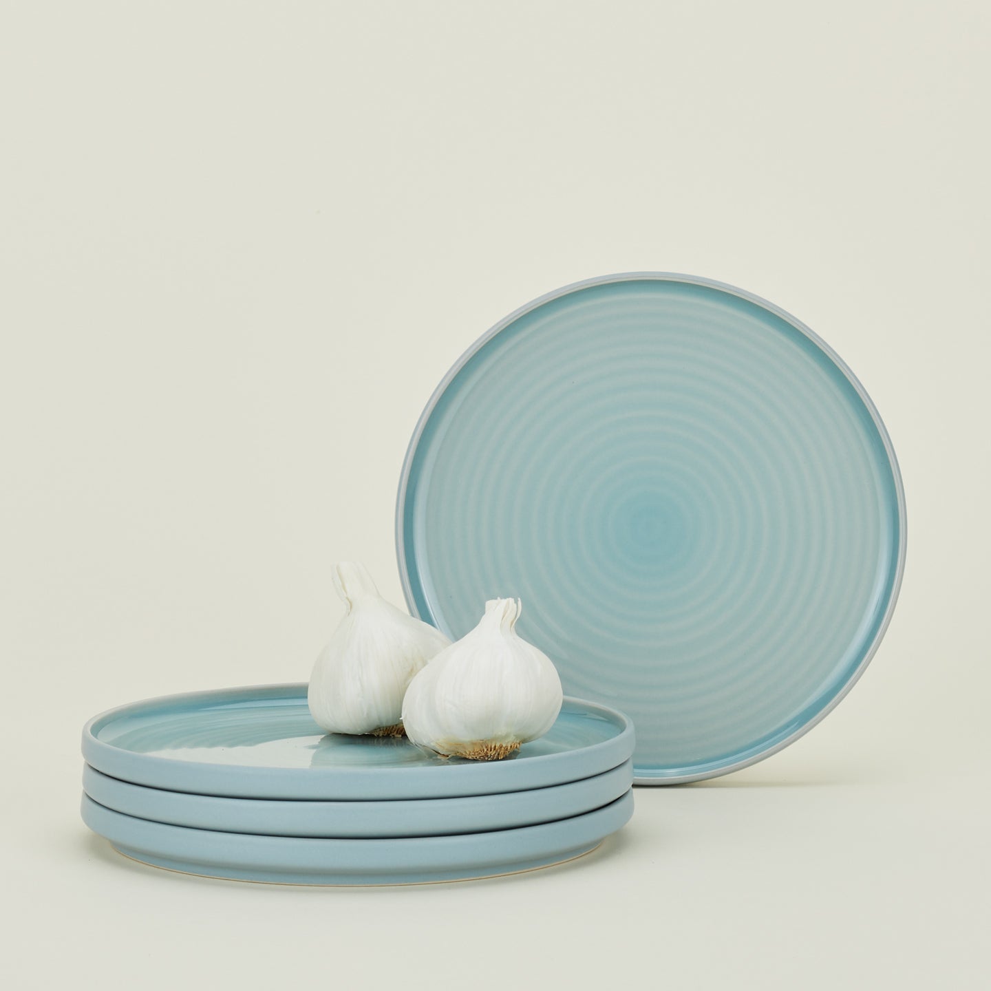 Four Essential Salad Plates in Sky, with garlic.
