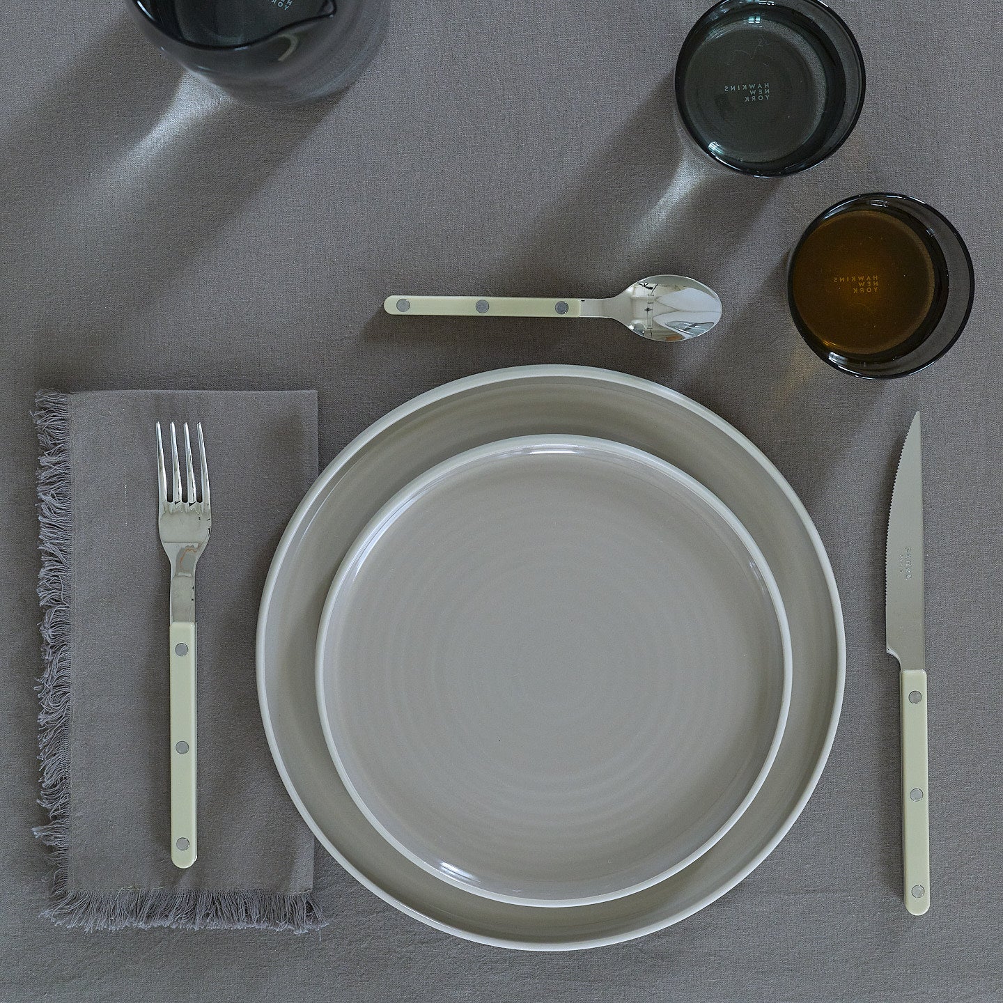 Placesetting on Essential Striped Tablecloth in Dark Grey.