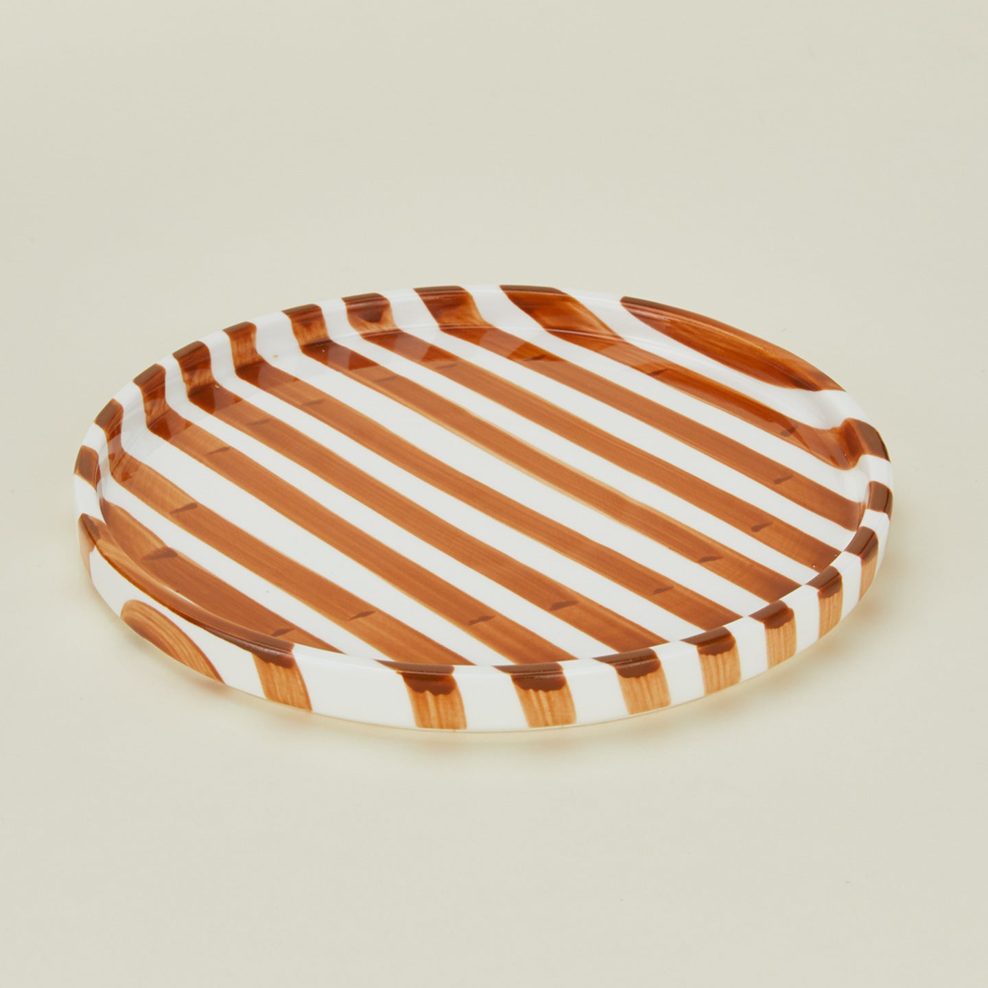 Detailed view of Fodory brown striped dinner plate