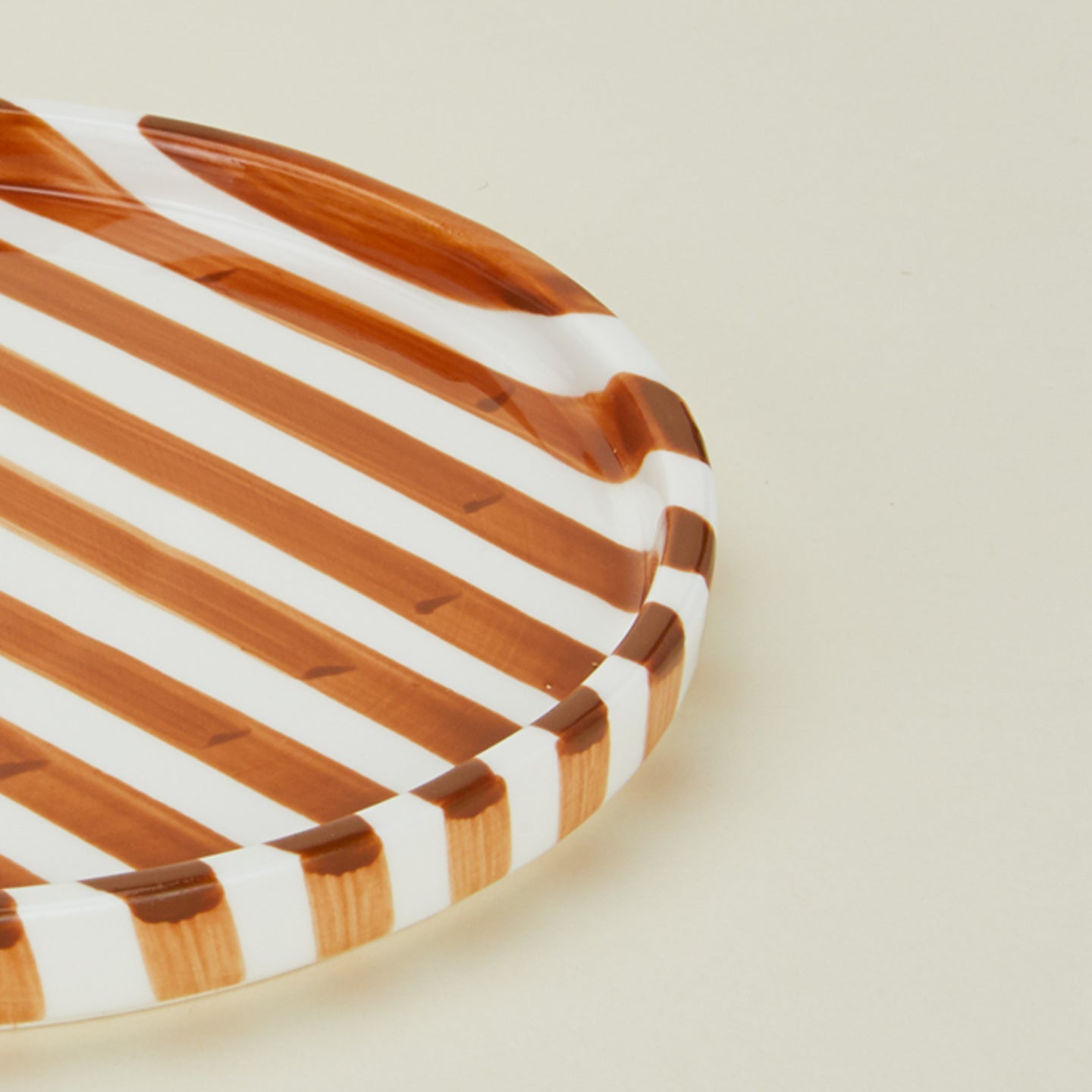 Close up view of Fodory brown striped dinner plate