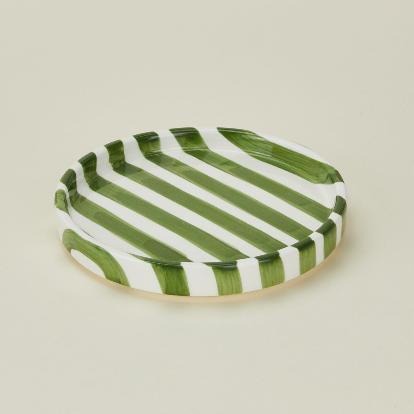 Detailed view of Fodory olive striped salad plate