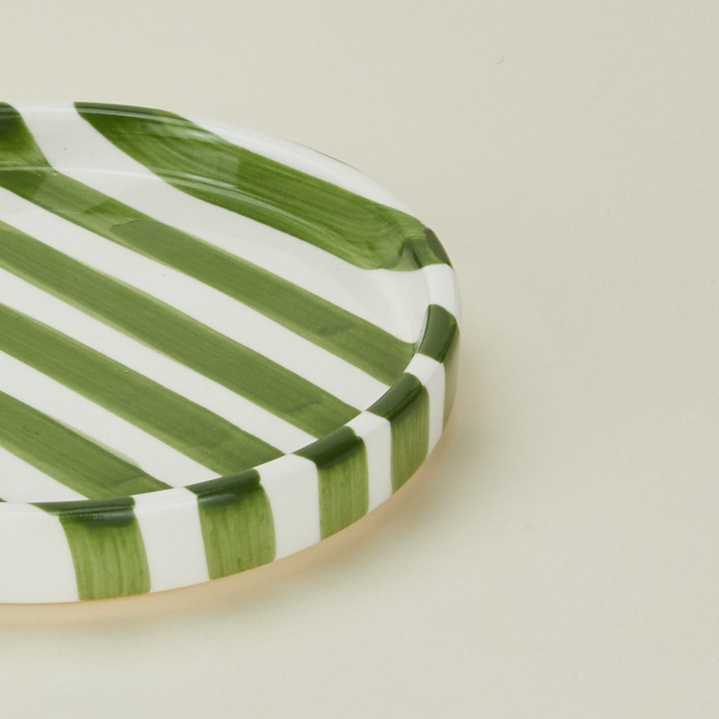 Close up view of Fodory olive striped salad plate