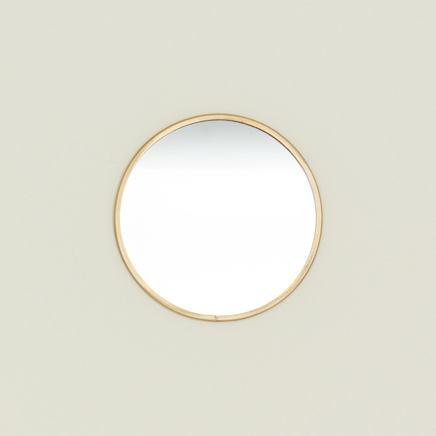 Round brass mirror.