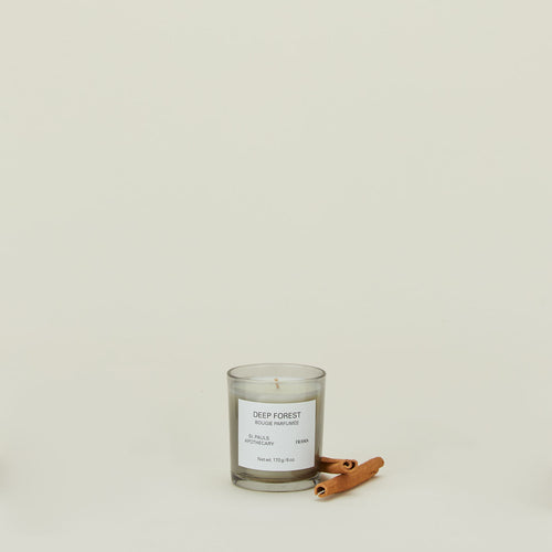 A wax candle with the scent Deep Forest, with cinnamon.